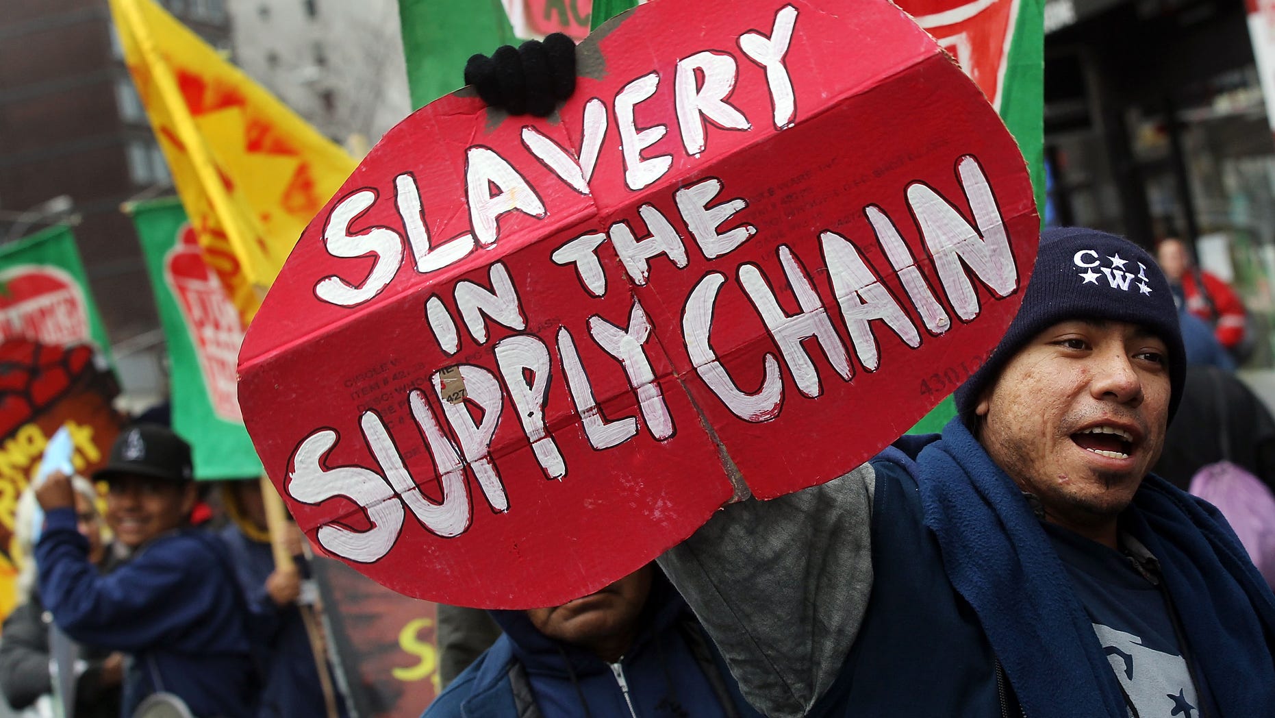 NEW YORK, NY - FEBRUARY 28: Members and supporters of the Coalition of Immokalee Workers (CIW) protest outside a Trader Joes store in Manhattan February 28, 2011 in New York City. The Florida farmworkers pick tomatoes for Trader Joes and other companies and are asking for workplace conditions to improve and for wages, which havent been raised since 1978, to be increased. The workers say Trader Joes has refused to sign a food pledge to pay an extra penny per pound of tomatoes. (Photo by Mario Tama/Getty Images)