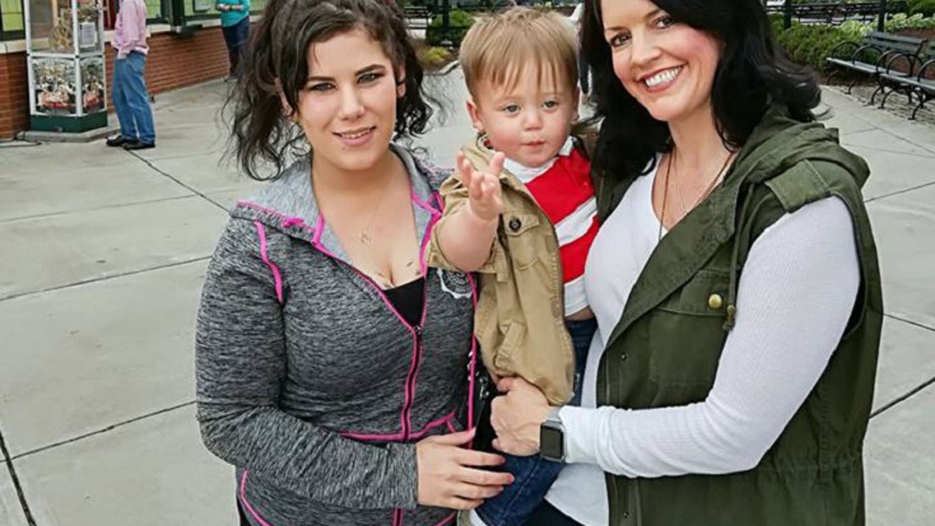 Samantha Snipes (left), Vaughn and Temple Phipps (right) pose for a picture.