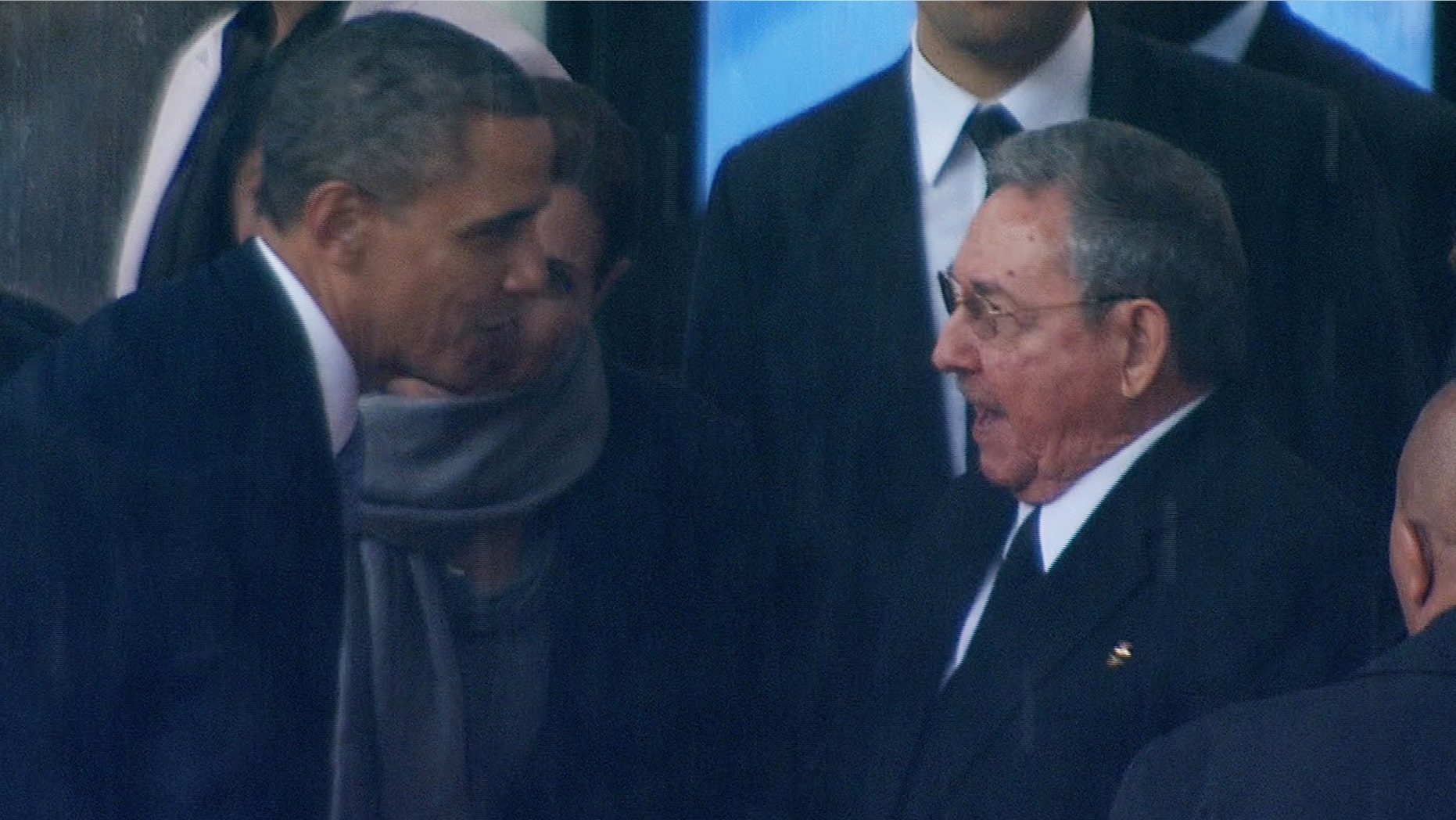 President Obama shakes hands with Cuban President Raul Castro at the FNB Stadium in Soweto, South Africa, during a memorial service for former South African President Nelson Mandela, Tuesday Dec. 10, 2013.