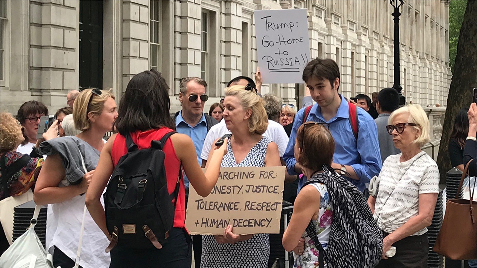 Protesters gather outside 10 Downing Street
