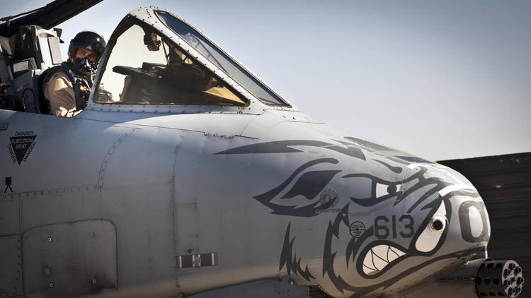 A pilot assigned to the 104th Expeditionary Fighter Squadron prepares an A-10 Thunderbolt II for a 2012 mission in Afghanistan. (Capt. Raymond Geoffroy/U.S. Air Force)