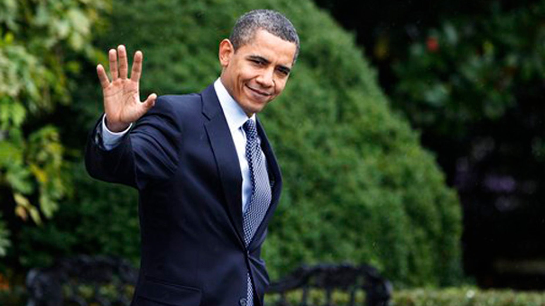 Sunday: President Obama waves as he leaves the White House for a day trip to New Jersey to campaign for Gov. Jon Corzine. (AP)
