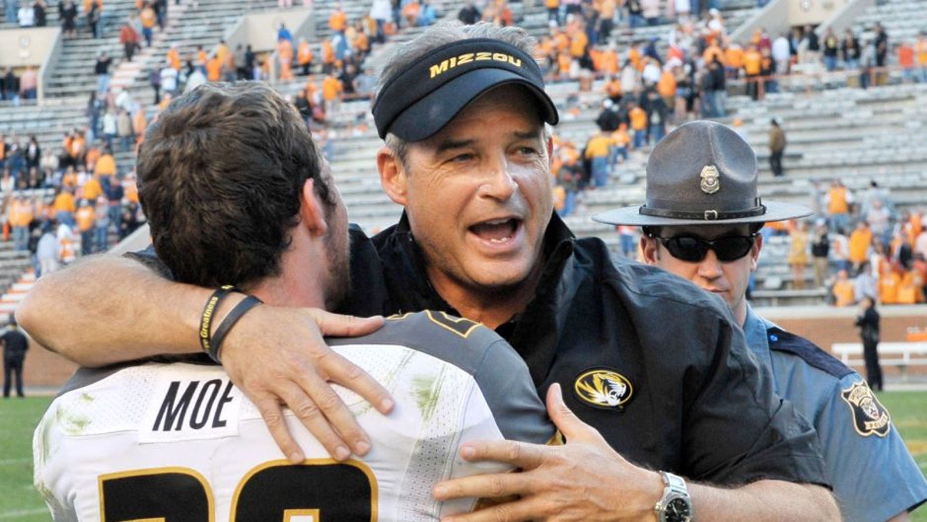 Nov 10, 2012; Knoxville, TN, USA; Missouri Tigers head coach Gary Pinkel celebrates with Missouri wide receiver T.J. Moe (28) after defeating the Tennessee Volunteers 51-48 in quadruple overtime at Neyland Stadium. Missouri defeated Tennessee . Mandatory Credit: Jim Brown-USA TODAY Sports