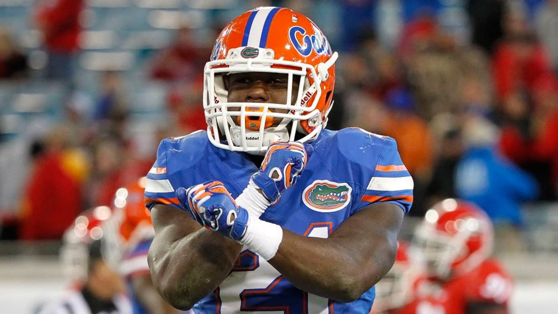 Nov 1, 2014; Jacksonville, FL, USA; Florida Gators running back Kelvin Taylor (21) reacts after scoring a touchdown against the Georgia Bulldogs during the second half at EverBank Field. Florida Gators defeated the Georgia Bulldogs 38-20. Mandatory Credit: Kim Klement-USA TODAY Sports