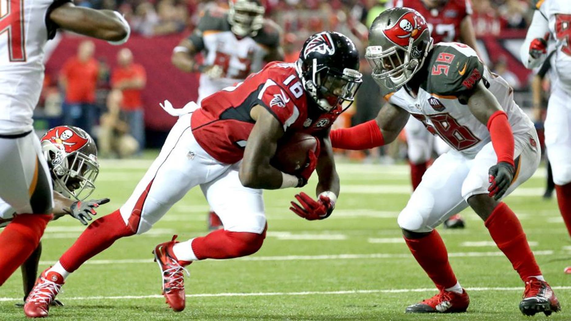Nov 1, 2015; Atlanta, GA, USA; Atlanta Falcons wide receiver Justin Hardy (16) runs after a catch as Tampa Bay Buccaneers middle linebacker Kwon Alexander (58) defends in the third quarter of their game at the Georgia Dome. The Buccaneers won 23-20 in overtime. Mandatory Credit: Jason Getz-USA TODAY Sports