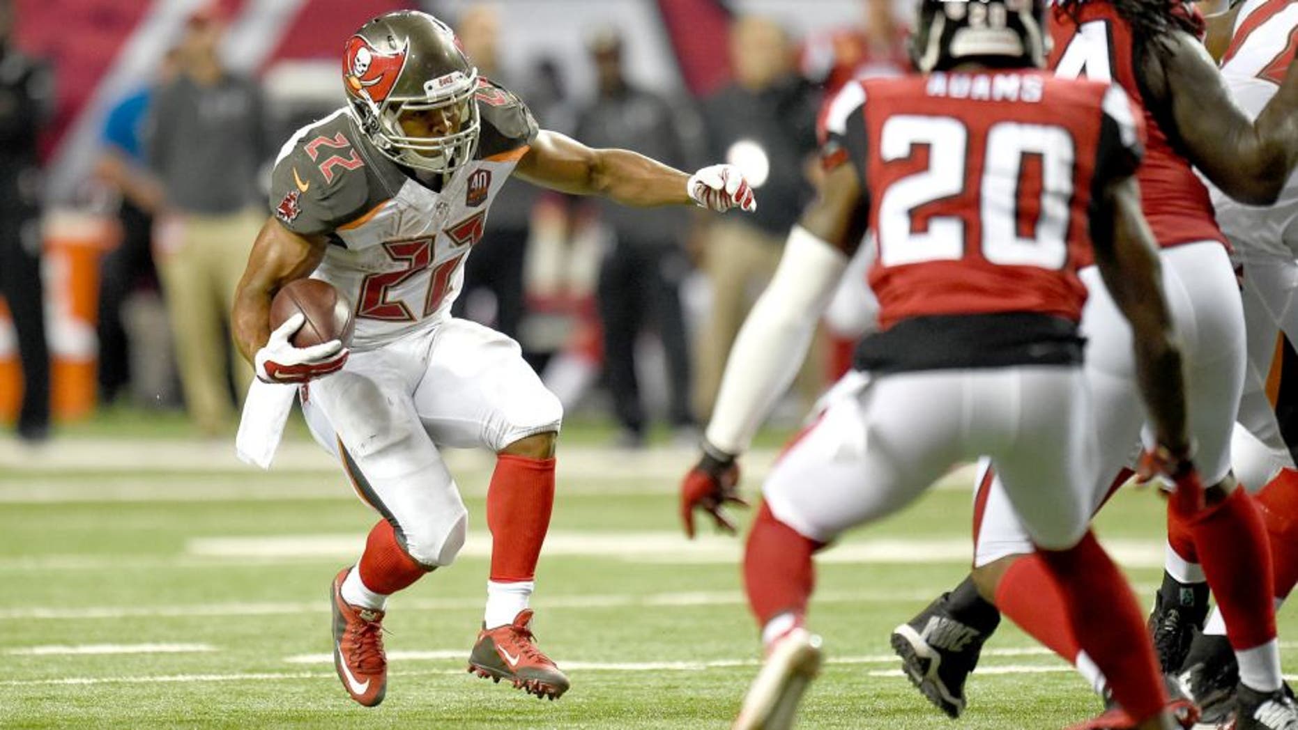 Nov 1, 2015; Atlanta, GA, USA; Tampa Bay Buccaneers running back Doug Martin (22) runs against the Atlanta Falcons during the second half at the Georgia Dome. The Buccaneers defeated the Falcons 23-20 in over time. Mandatory Credit: Dale Zanine-USA TODAY Sports
