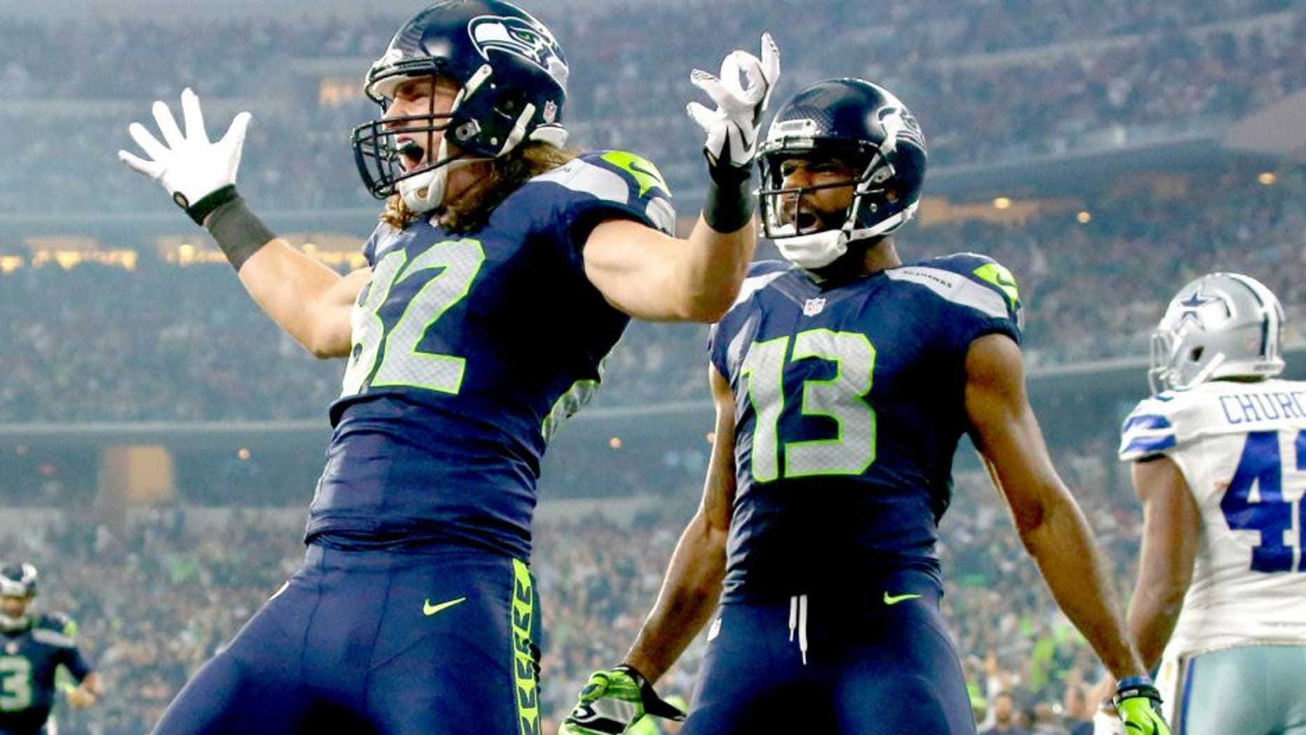 ARLINGTON, TX - NOVEMBER 1: Luke Willson #82 of the Seattle Seahawks celebrates as teammate Chris Matthews #13 looks on after scoring a touchdown against the Dallas Cowboys in the second quarter at AT&T Stadium on November 1, 2015 in Arlington, Texas. (Photo by Ronald Martinez/Getty Images)
