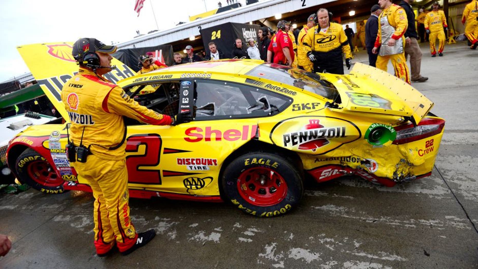 MARTINSVILLE, VA - NOVEMBER 01: The #22 Shell Pennzoil Ford of Joey Logano is towed into the garage area after an incident with Matt Kenseth, driver of the #20 Dollar General Toyota, during the NASCAR Sprint Cup Series Goody's Headache Relief Shot 500 at Martinsville Speedway on November 1, 2015 in Martinsville, Virginia. (Photo by Robert Laberge/Getty Images)