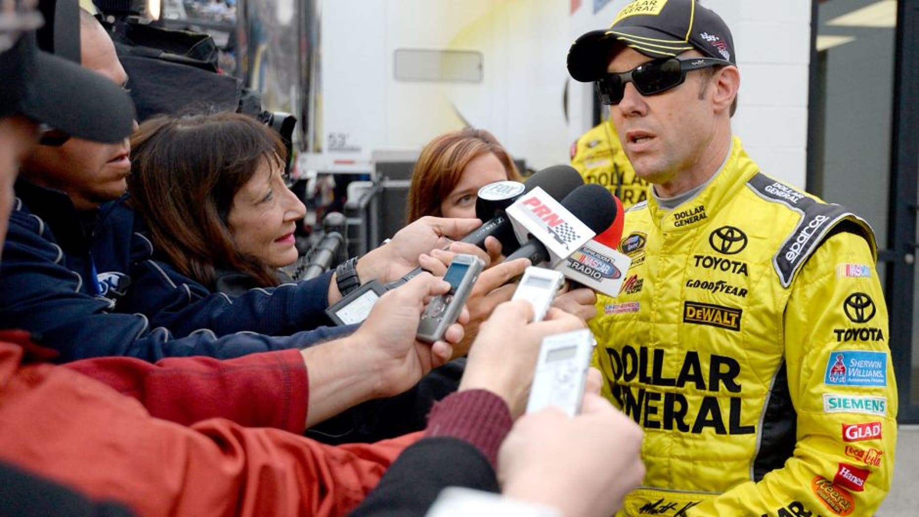 MARTINSVILLE, VA - NOVEMBER 01: Matt Kenseth, driver of the #20 Dollar General Toyota, speaks with the media after an on-track incident with Joey Logano, driver of the #22 Shell Pennzoil Ford, during the NASCAR Sprint Cup Series Goody's Headache Relief Shot 500 at Martinsville Speedway on November 1, 2015 in Martinsville, Virginia. (Photo by Robert Laberge/Getty Images)