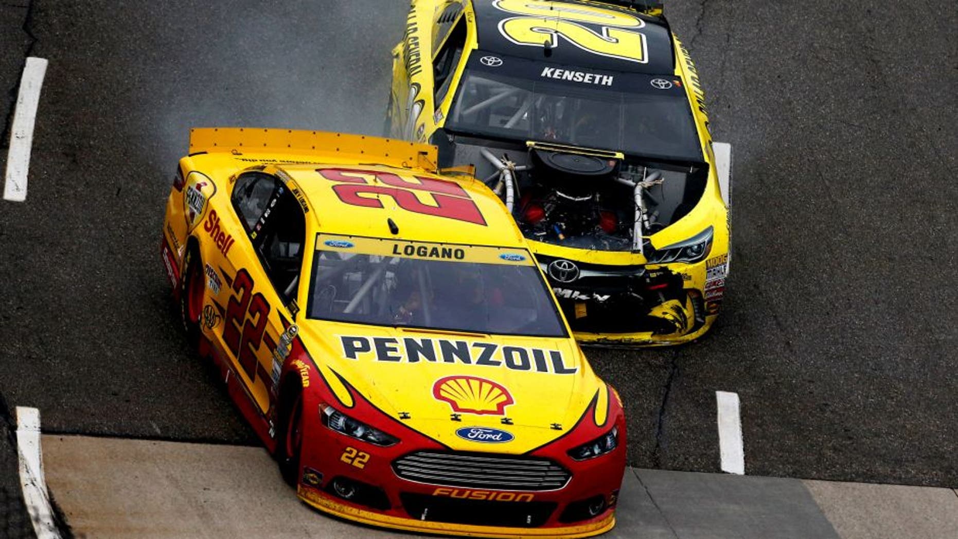 MARTINSVILLE, VA - NOVEMBER 01: Matt Kenseth, driver of the #20 Dollar General Toyota, crashes hits Joey Logano, driver of the #22 Shell Pennzoil Ford, during the NASCAR Sprint Cup Series Goody's Headache Relief Shot 500 at Martinsville Speedway on November 1, 2015 in Martinsville, Virginia. (Photo by Jeff Zelevansky/Getty Images)