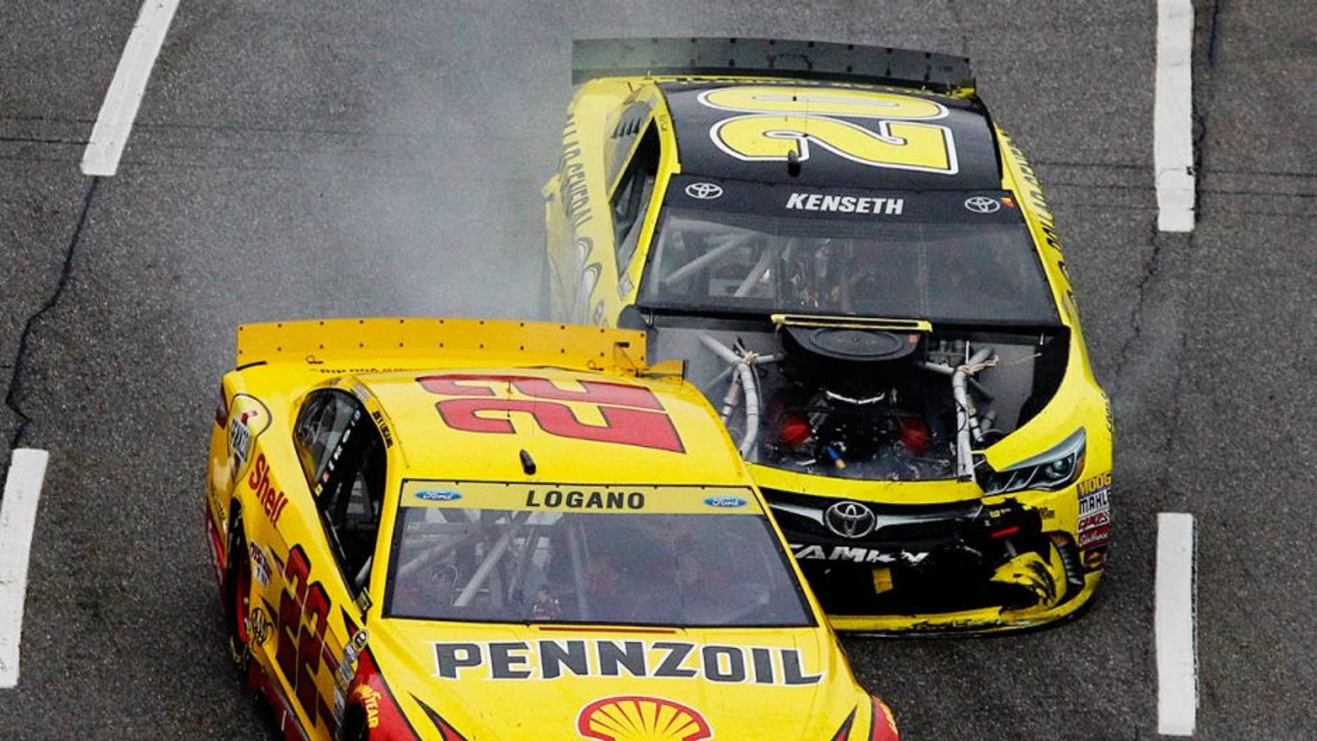 MARTINSVILLE, VA - NOVEMBER 01: Matt Kenseth, driver of the #20 Dollar General Toyota, makes contact with Joey Logano, driver of the #22 Shell Pennzoil Ford, during the NASCAR Sprint Cup Series Goody's Headache Relief Shot 500 at Martinsville Speedway on November 1, 2015 in Martinsville, Virginia. (Photo by Brian Lawdermilk/NASCAR via Getty Images)