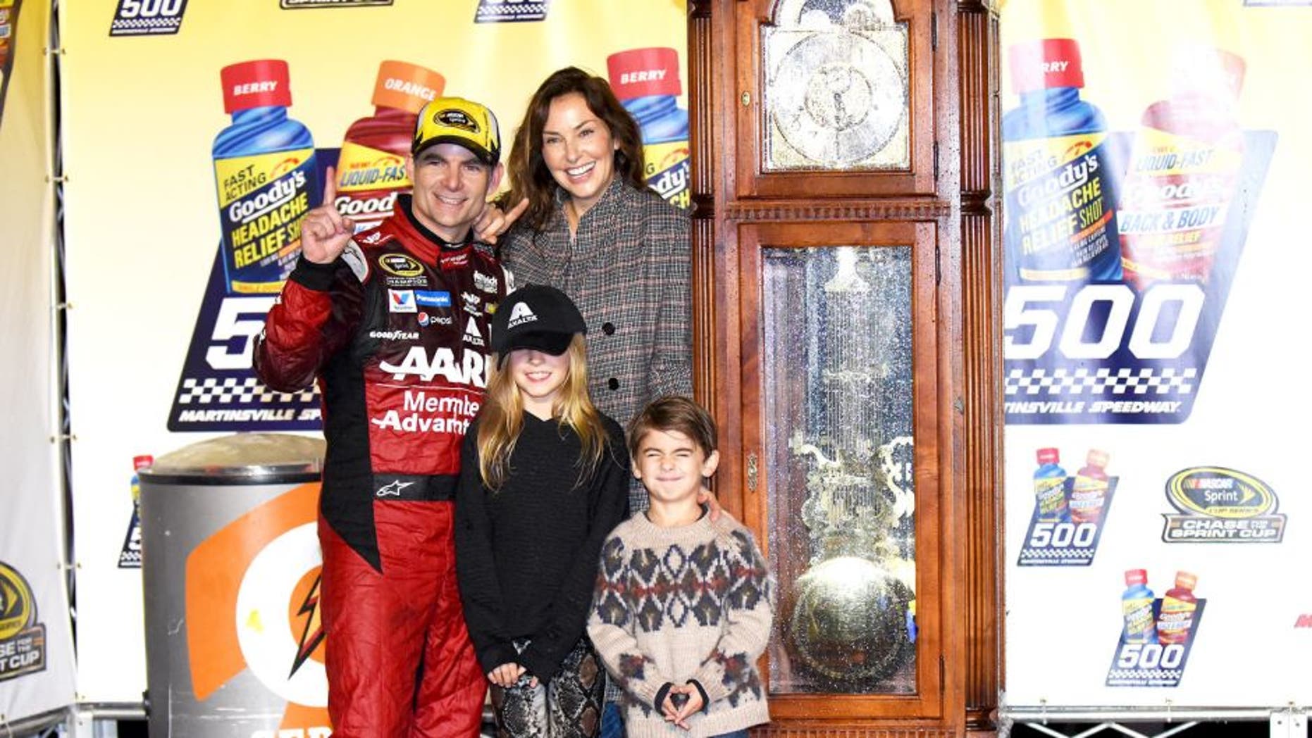 MARTINSVILLE, VA - NOVEMBER 01: Jeff Gordon, driver of the #24 AARP Member Advantages Chevrolet, celebrates in Victory Lane with his wife Ingrid Vandebosch, daughter Ella and son Leo after winning the NASCAR Sprint Cup Series Goody's Headache Relief Shot 500 at Martinsville Speedway on November 1, 2015 in Martinsville, Virginia. (Photo by Jonathan Moore/Getty Images)