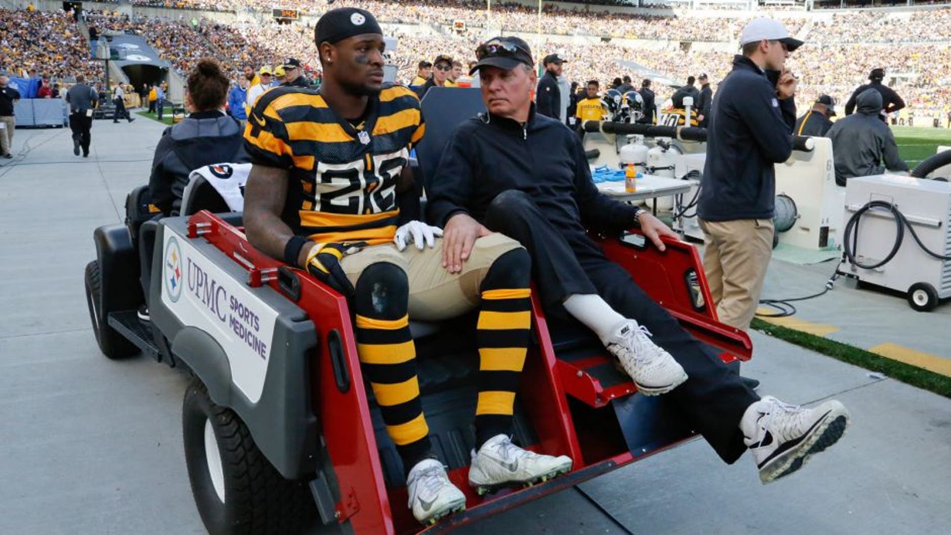 Pittsburgh Steelers running back Le'Veon Bell (26) is carted off the field after being injured in the second quarter of an NFL football game against the Cincinnati Bengals, Sunday, Nov. 1, 2015, in Pittsburgh. (AP Photo/Gene Puskar)