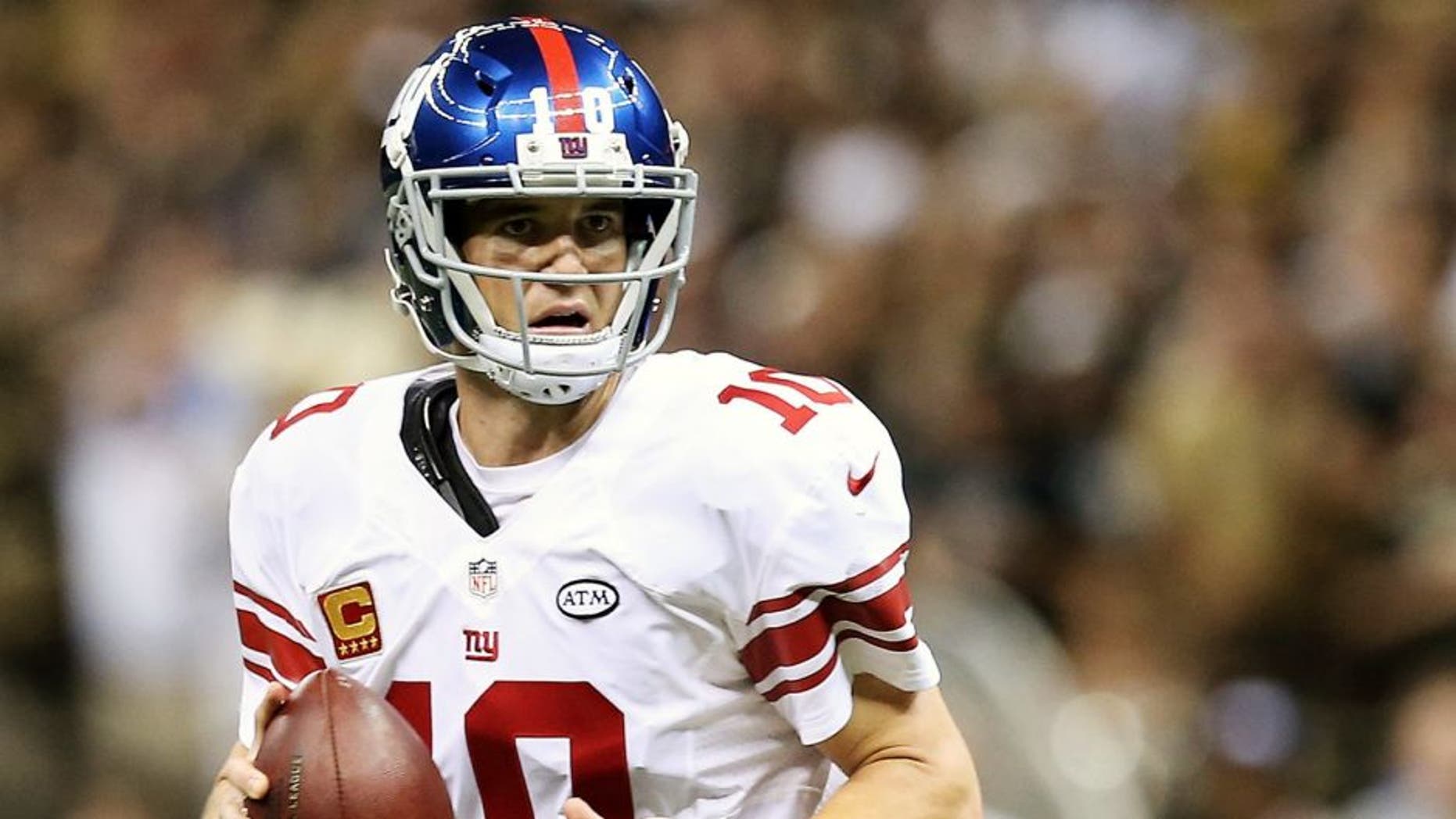 NEW ORLEANS, LA - NOVEMBER 01: Eli Manning #10 of the New York Giants looks to pass on fourth down during the fourth quarter of a game against the New Orleans Saints at the Mercedes-Benz Superdome on November 1, 2015 in New Orleans, Louisiana. (Photo by Sean Gardner/Getty Images)