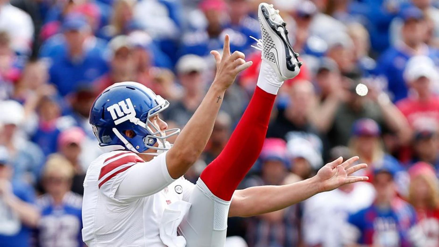 Oct 4, 2015; Orchard Park, NY, USA; New York Giants punter Brad Wing (9) during the game against the Buffalo Bills at Ralph Wilson Stadium. Mandatory Credit: Kevin Hoffman-USA TODAY Sports