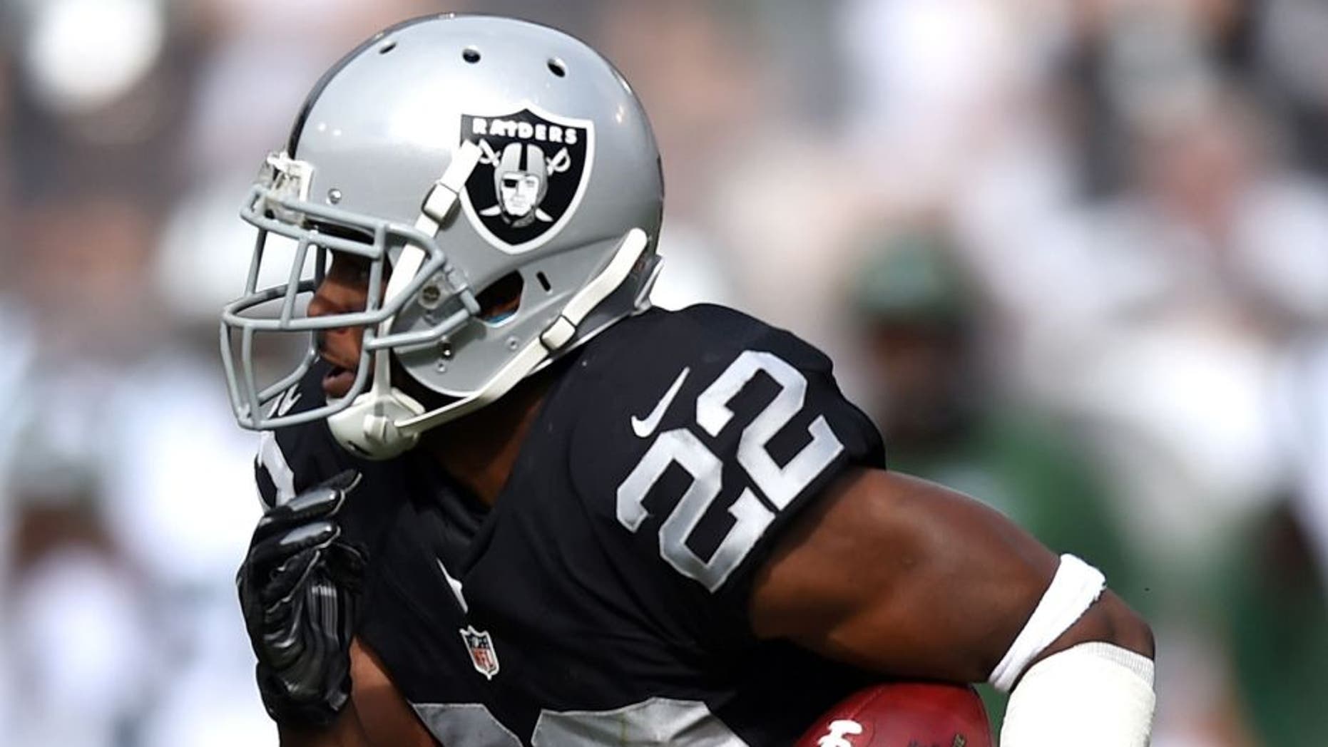 OAKLAND, CA - NOVEMBER 01: Taiwan Jones #22 of the Oakland Raiders rushes with the ball against the New York Jets during their NFL game at O.co Coliseum on November 1, 2015 in Oakland, California. (Photo by Thearon W. Henderson/Getty Images)