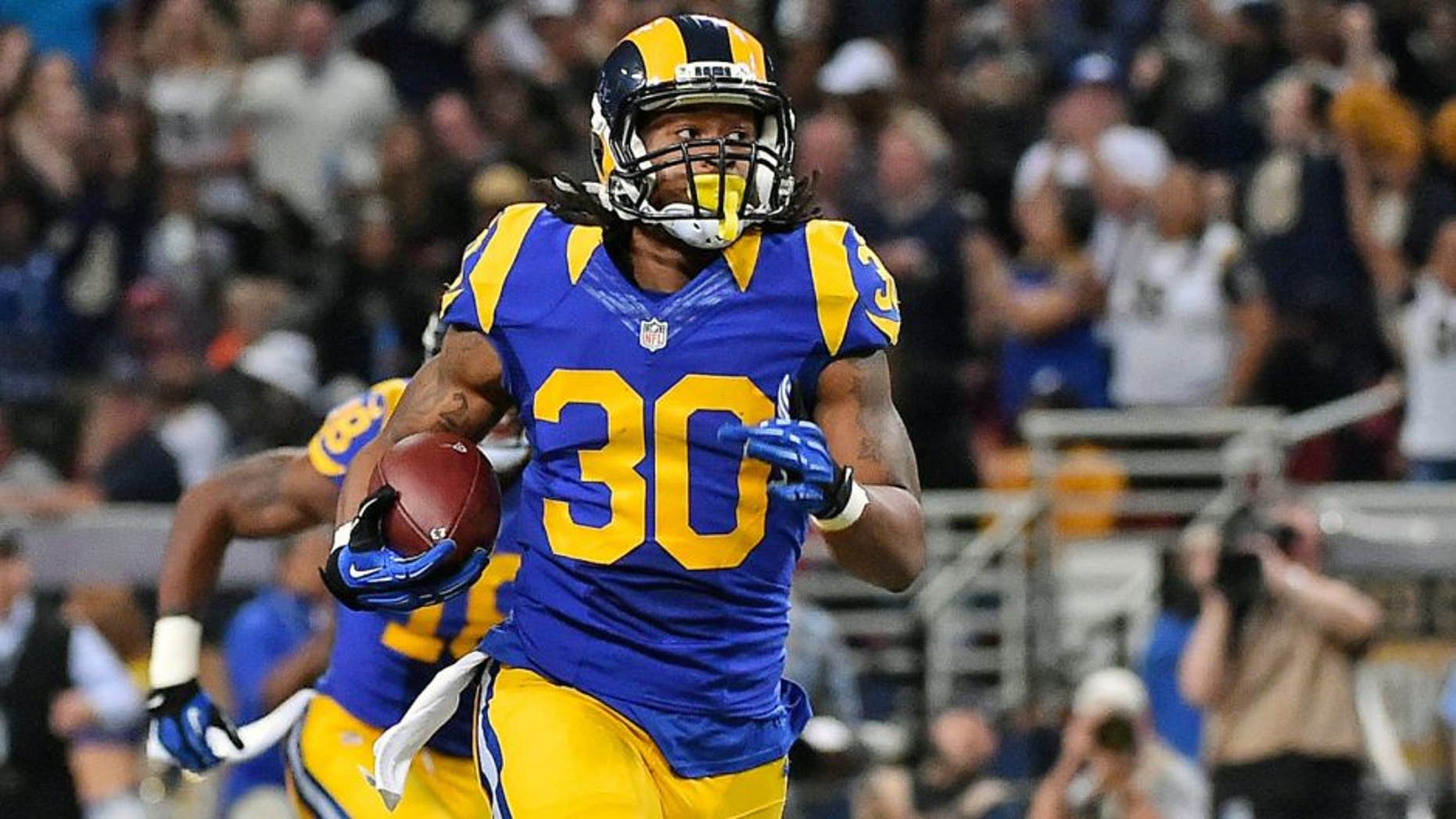 Nov 1, 2015; St. Louis, MO, USA; St. Louis Rams running back Todd Gurley (30) carries the ball to score a seventy one yard touchdown against the San Francisco 49ers during the first half at the Edward Jones Dome. Mandatory Credit: Jasen Vinlove-USA TODAY Sports