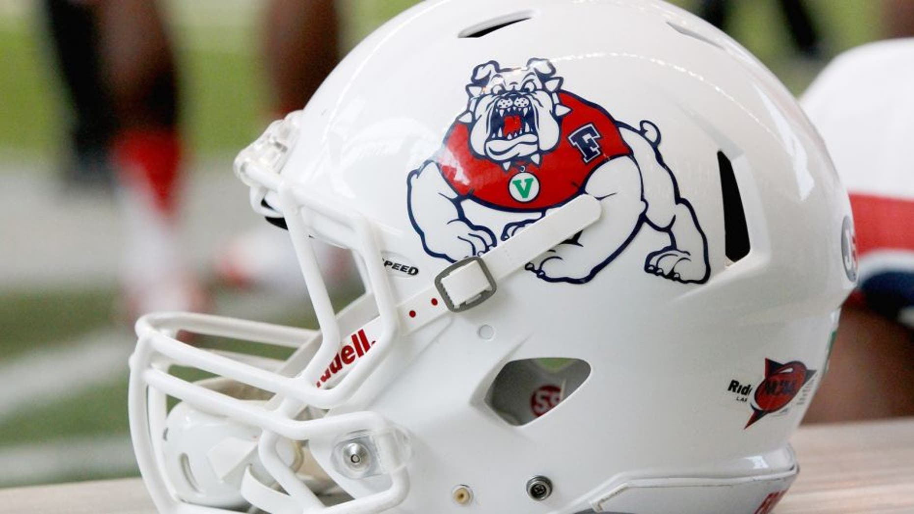 MOSCOW, ID - OCTOBER 05: A Fresno State Bulldogs football helmet sits on the sideline during the game between the Fresno State Bulldogs and the Idaho Vandals on October 5, 2013 at the Kibbie Dome in Moscow, Idaho. (Photo by William Mancebo/Getty Images)