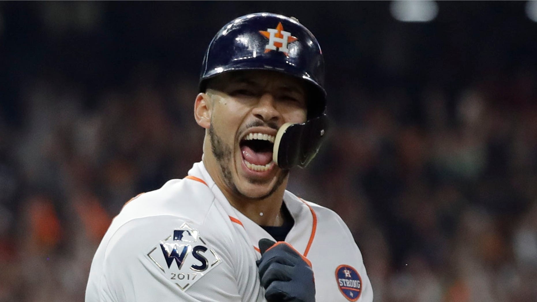 Houston Astros' Carlos Correa celebrates his two-run home run during the seventh inning of Game 5 of baseball's World Series against the Los Angeles Dodgers Sunday, Oct. 29, 2017, in Houston.