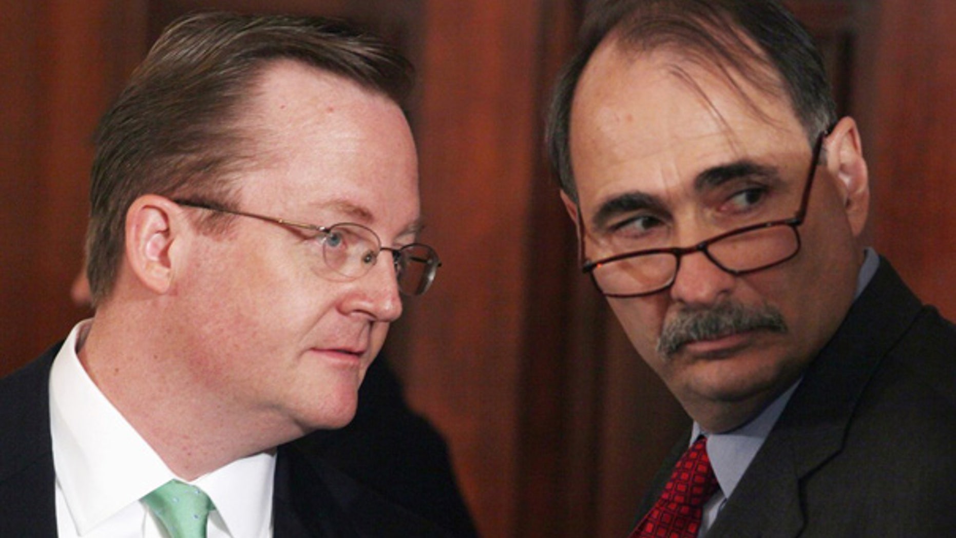Sept. 10: White House Press Secretary Robert Gibbs confers with President Obama Senior Adviser David Axelrod in the White House.
