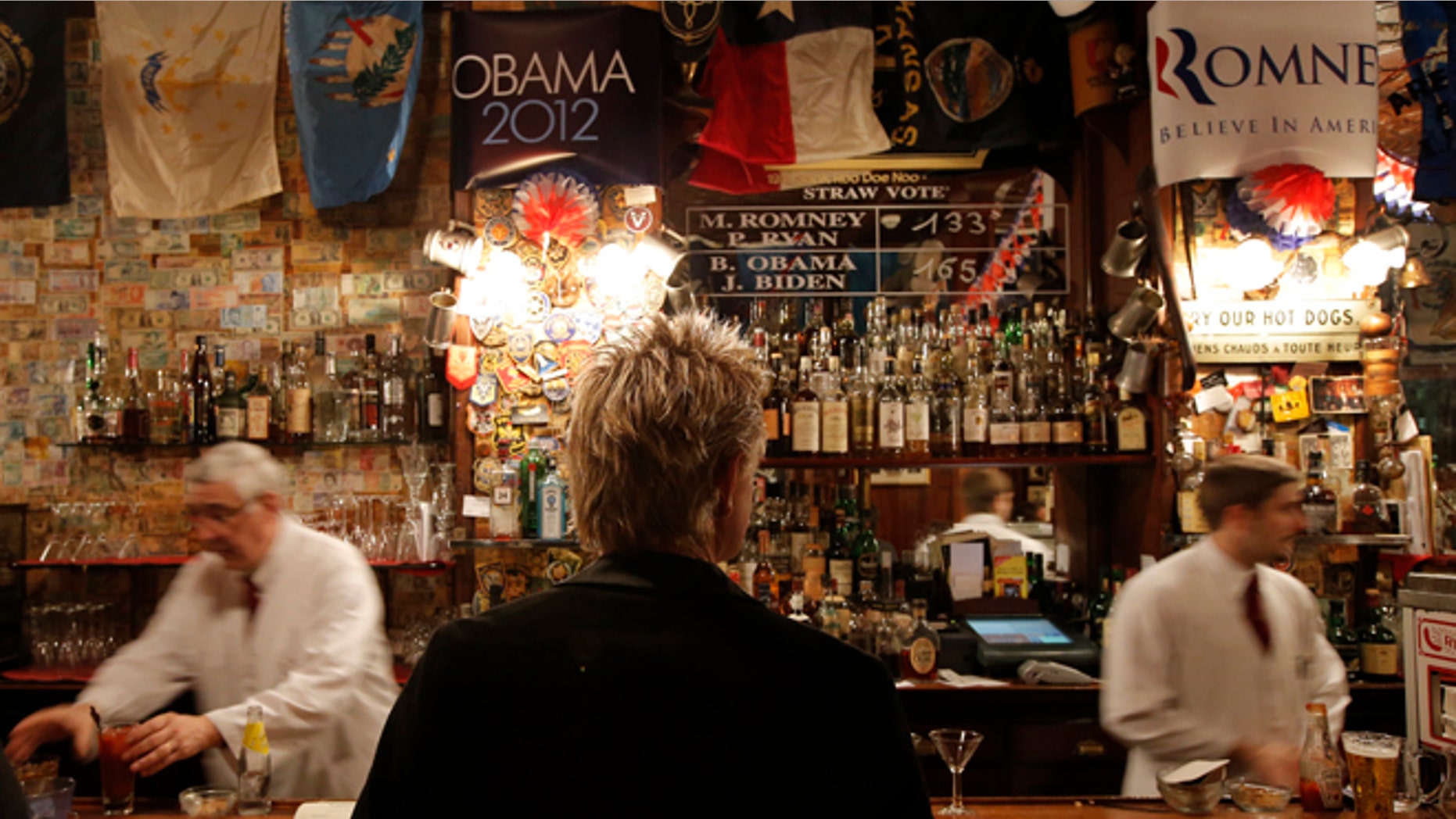 Oct. 31, 2012: The temporary results of a U.S. presidential election straw vote is displayed on a board at Harry's Bar in Paris.