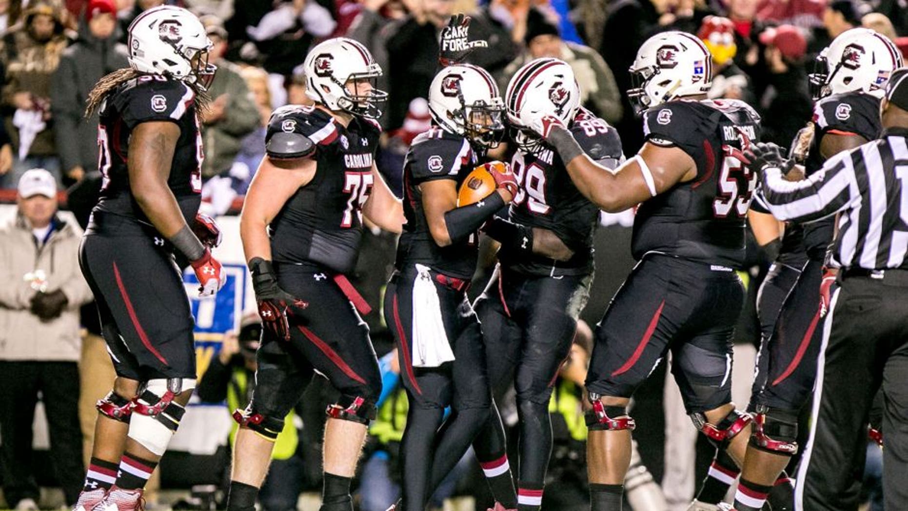 Nov 1, 2014; Columbia, SC, USA; South Carolina Gamecocks wide receiver Pharoh Cooper (11) is congratulated for a touchdown against the Tennessee Volunteers in the first quarter at Williams-Brice Stadium. Mandatory Credit: Jeff Blake-USA TODAY Sports