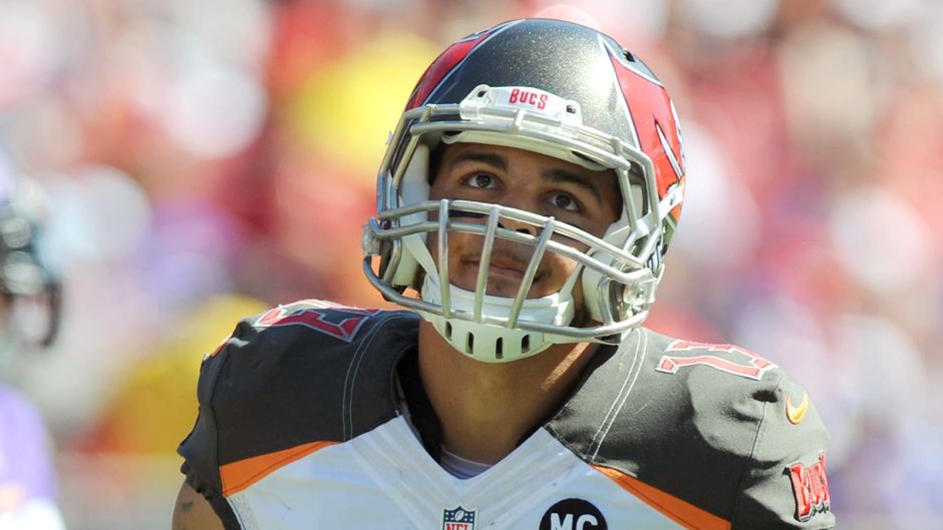 TAMPA, FL - OCTOBER 26: Wide receiver Mike Evans #13 of the Tampa Bay Buccaneers runs off the field at Raymond James Stadium on October 26, 2014 in Tampa, Florida. (Photo by Cliff McBride/Getty Images)