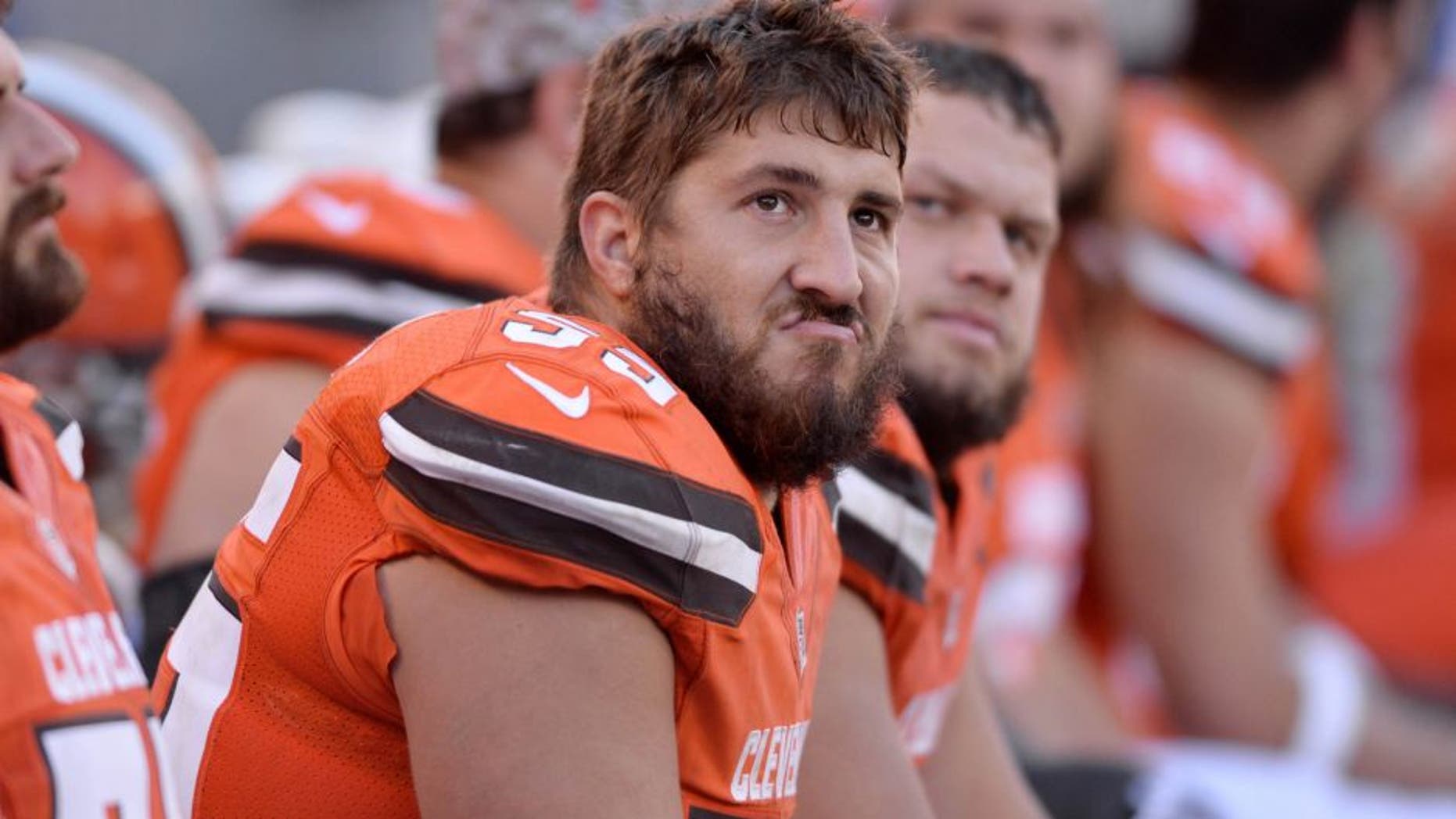 Nov 1, 2015; Cleveland, OH, USA; Cleveland Browns center Alex Mack (55) and guard Joel Bitonio (75) sit on the bench during the fourth quarter against the Arizona Cardinals at FirstEnergy Stadium. The Cardinals won 34-20. Mandatory Credit: Ken Blaze-USA TODAY Sports
