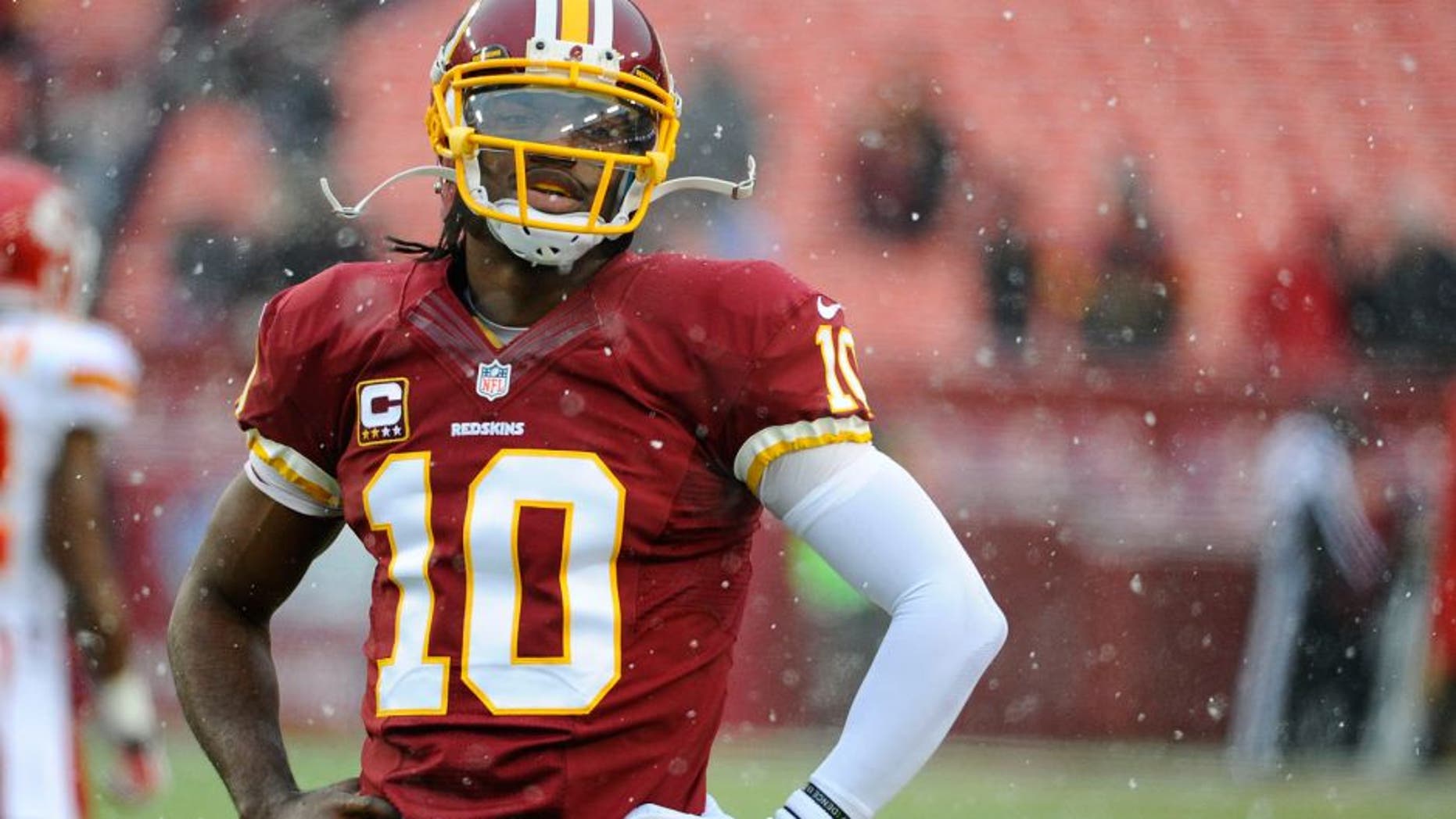 Dec 8, 2013; Landover, MD, USA; Washington Redskins quarterback Robert Griffin III (10) warms up before the game against the Kansas City Chiefs at FedEx Field. Mandatory Credit: Brad Mills-USA TODAY Sports