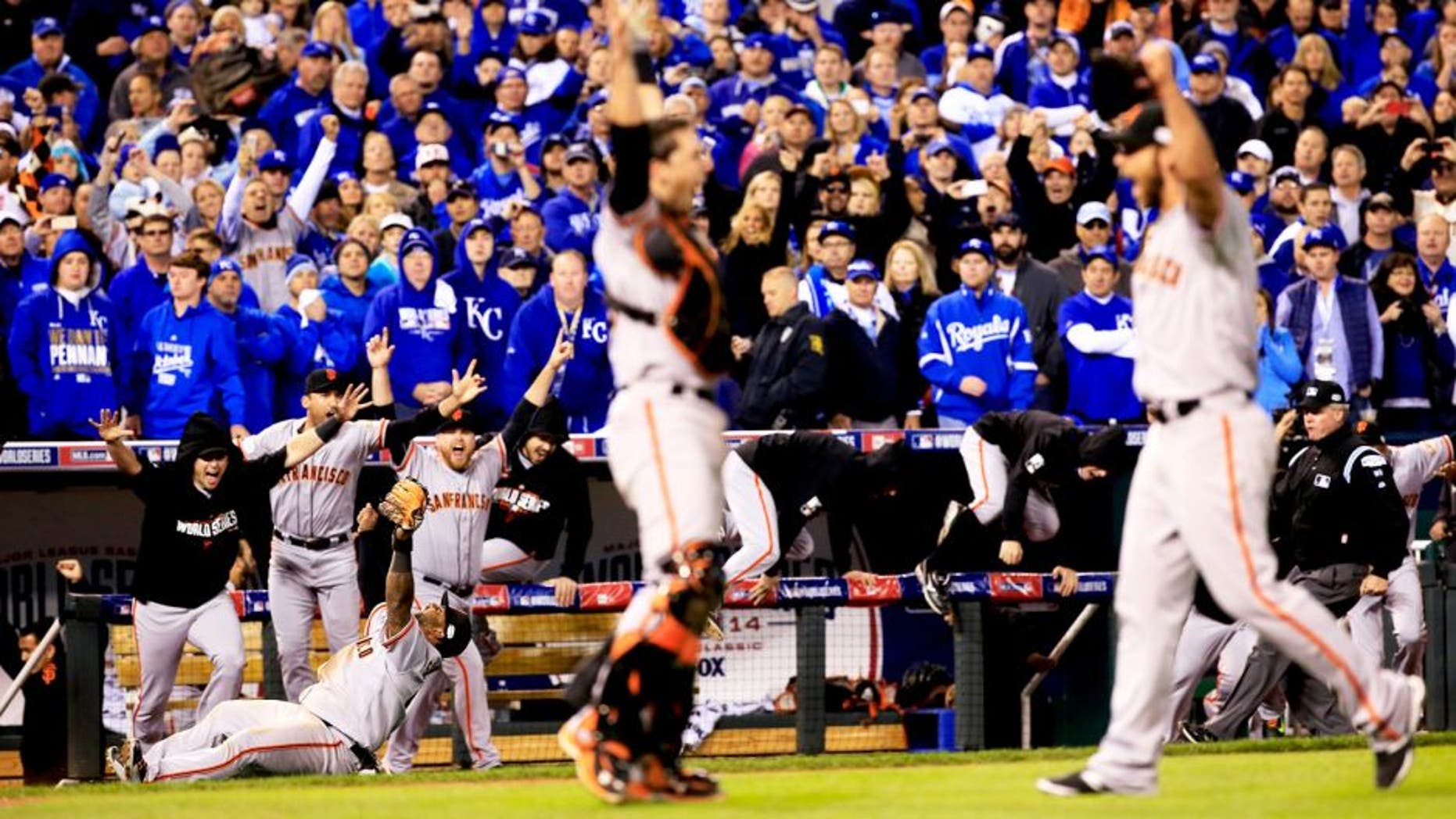 KANSAS CITY, MO - OCTOBER 29: Buster Posey #28 , Madison Bumgarner #40, Pablo Sandoval #48 and the San Francisco Giants celebrate after defeating the Kansas City Royals to win Game Seven of the 2014 World Series by a score of 3-2 at Kauffman Stadium on October 29, 2014 in Kansas City, Missouri. (Photo by Jamie Squire/Getty Images)