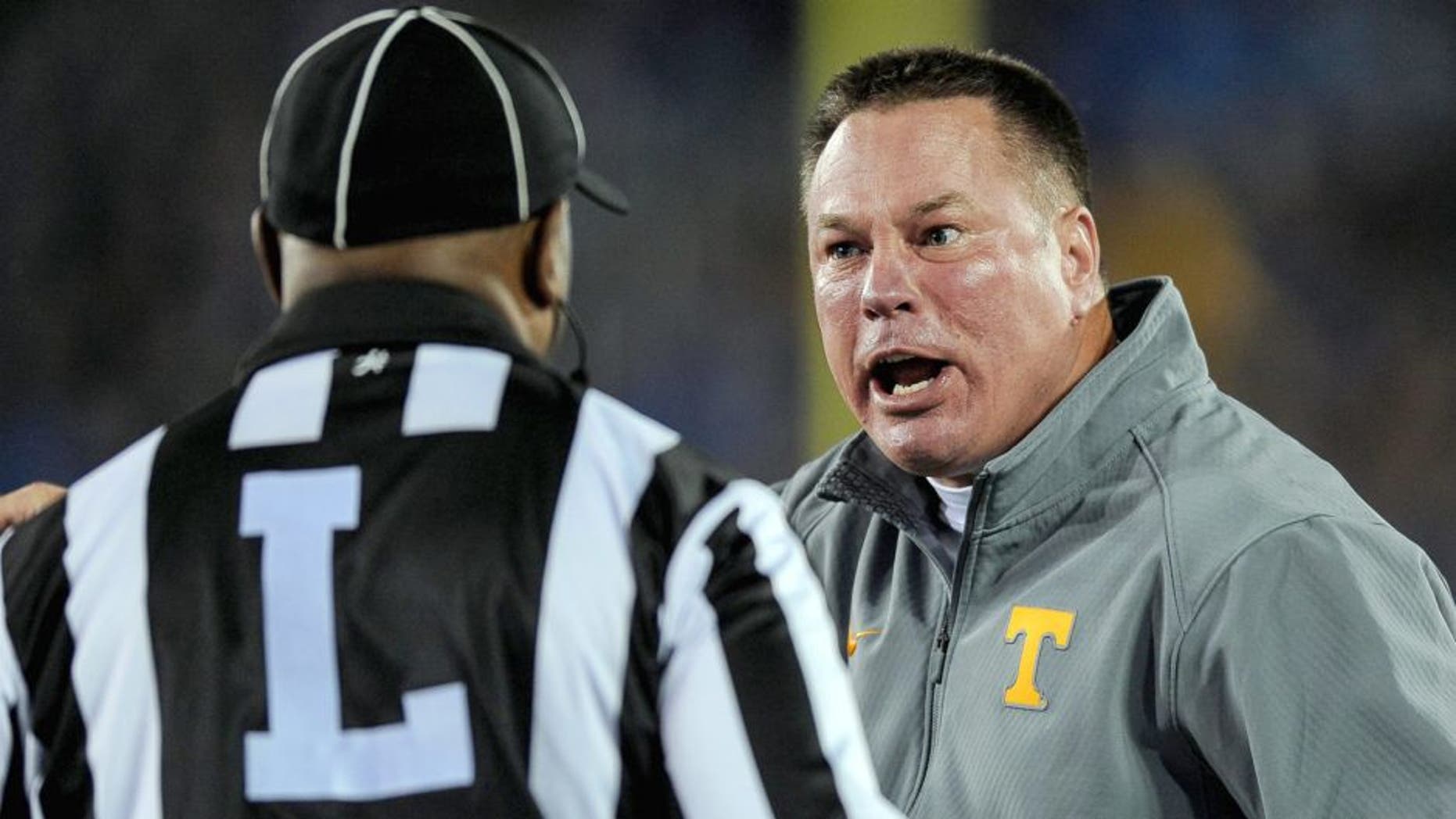 Oct 31, 2015; Lexington, KY, USA; Tennessee Volunteers head coach Butch Jones argues a call with the referee against the Kentucky Wildcats at Commonwealth Stadium. Mandatory Credit: Bryan Lynn-USA TODAY Sports