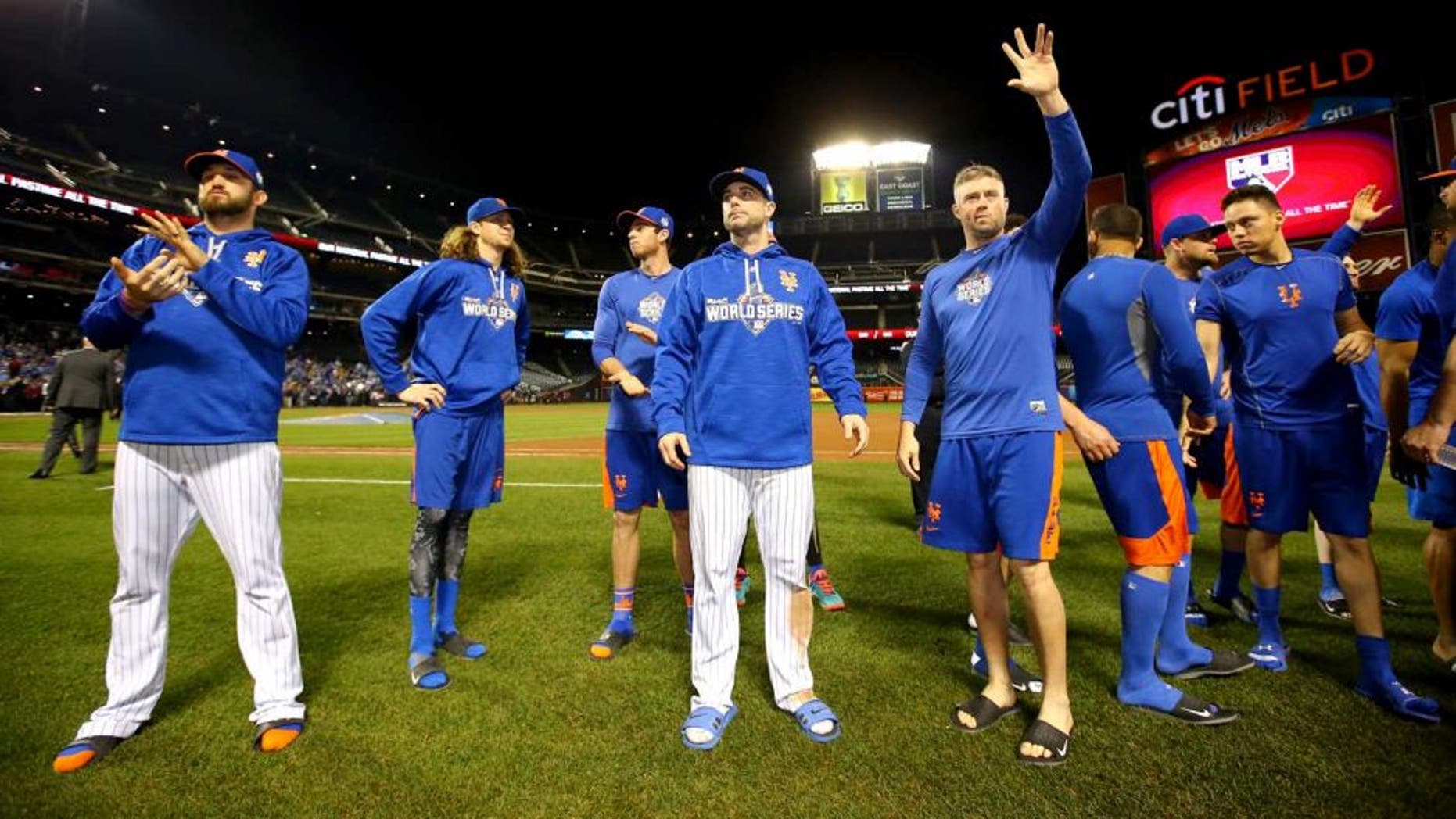 NEW YORK, NY - NOVEMBER 01: (L-R) New York Mets players Jonathon Niese #49, Jacob deGrom #48, and David Wright #5 wave to fans after Game Five of the 2015 World Series at Citi Field on November 1, 2015 in the Flushing neighborhood of the Queens borough of New York City. The Kansas City Royals defeated the New York Mets with a score of 7 to 2 to win the World Series. (Photo by Al Bello/Getty Images)
