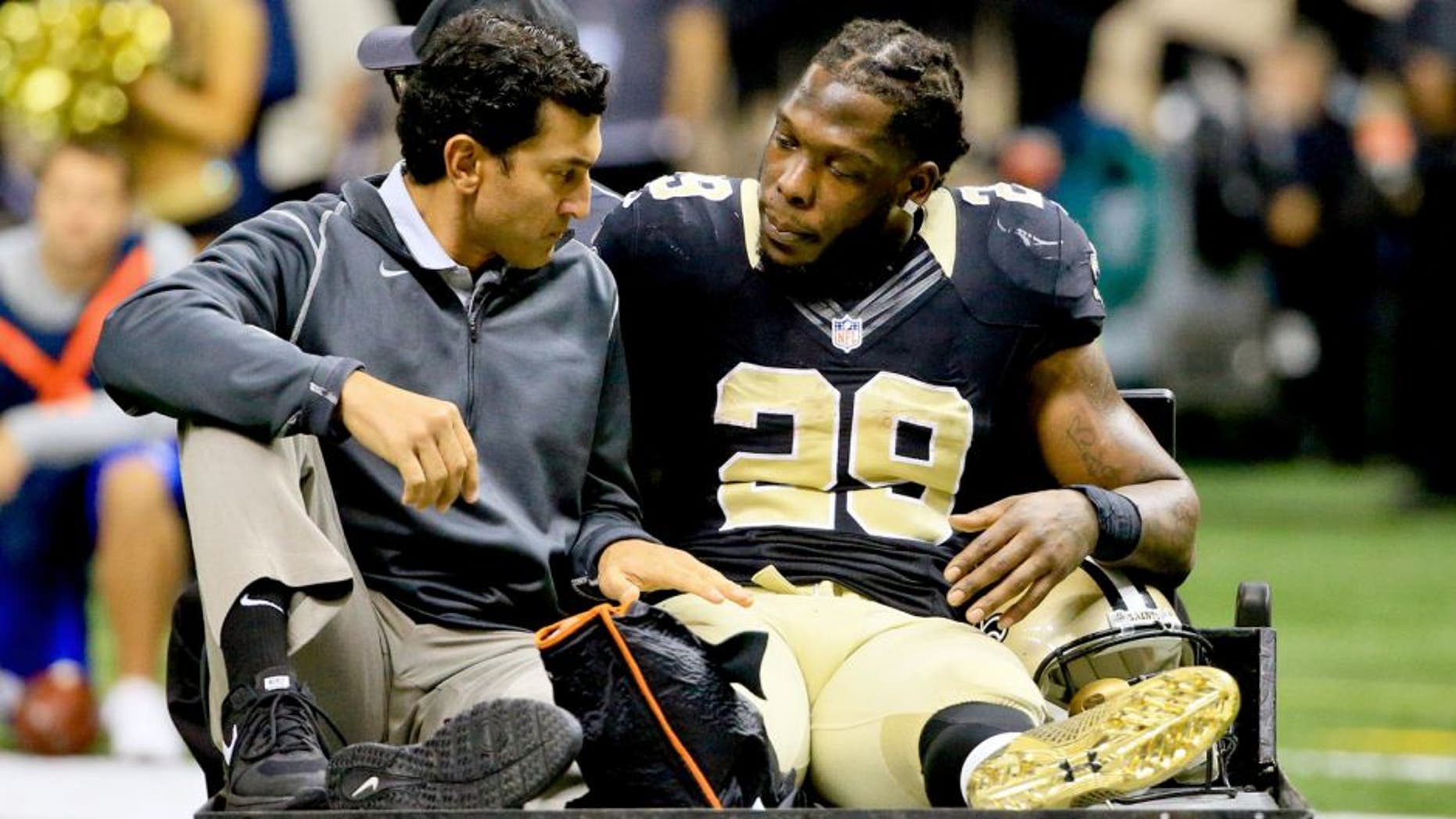 Nov 1, 2015; New Orleans, LA, USA; New Orleans Saints running back Khiry Robinson (29) is carted off the field following a leg injury against the New York Giants during the second quarter of a game at the Mercedes-Benz Superdome. Mandatory Credit: Derick E. Hingle-USA TODAY Sports