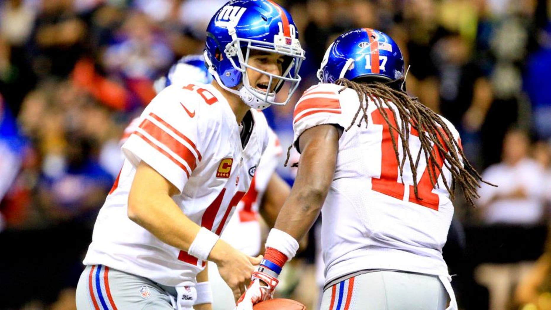 Nov 1, 2015; New Orleans, LA, USA; New York Giants quarterback Eli Manning (10) celebrates with wide receiver Dwayne Harris (17) after a tochdown during the fourth quarter of a game against the New Orleans Saints at the Mercedes-Benz Superdome. The Saints defeated the Giants 52-49. Mandatory Credit: Derick E. Hingle-USA TODAY Sports