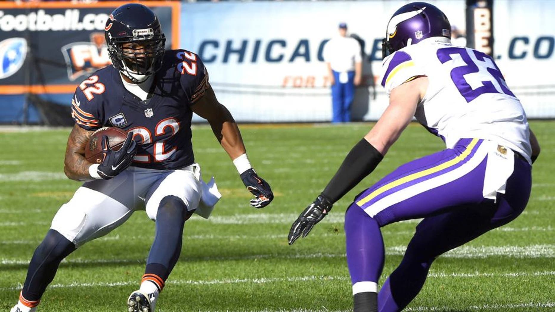 Nov 1, 2015; Chicago, IL, USA; Chicago Bears running back Matt Forte (22) carries the ball as Minnesota Vikings free safety Harrison Smith (22) defends during the second half at Soldier Field. Mandatory Credit: Mike DiNovo-USA TODAY Sports