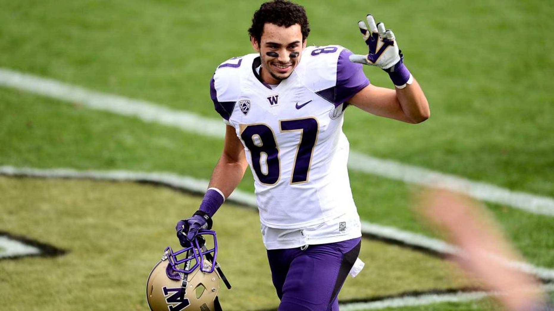Nov 1, 2014; Boulder, CO, USA; Washington Huskies wide receiver Dante Pettis (87) reacts following the win over the Colorado Buffaloes at Folsom Field. The Huskies defeated the Buffaloes 38-23. Mandatory Credit: Ron Chenoy-USA TODAY Sports