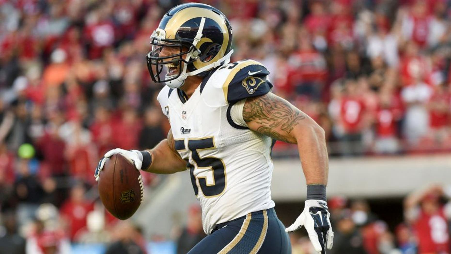 November 2, 2014; Santa Clara, CA, USA; St. Louis Rams middle linebacker James Laurinaitis (55) celebrates after recovering the football during the fourth quarter against the San Francisco 49ers at Levi's Stadium. The Rams defeated the 49ers 13-10. Mandatory Credit: Kyle Terada-USA TODAY Sports