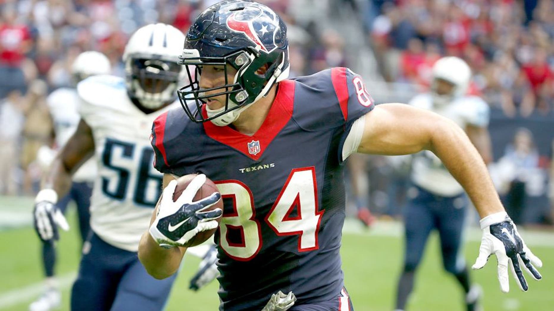 HOUSTON, TX - NOVEMBER 30: Ryan Griffin #84 of the Houston Texans runs for touchdown against the Tennessee Titans in the first quarter in a NFL game on November 30, 2014 at NRG Stadium in Houston, Texas. (Photo by Scott Halleran/Getty Images)
