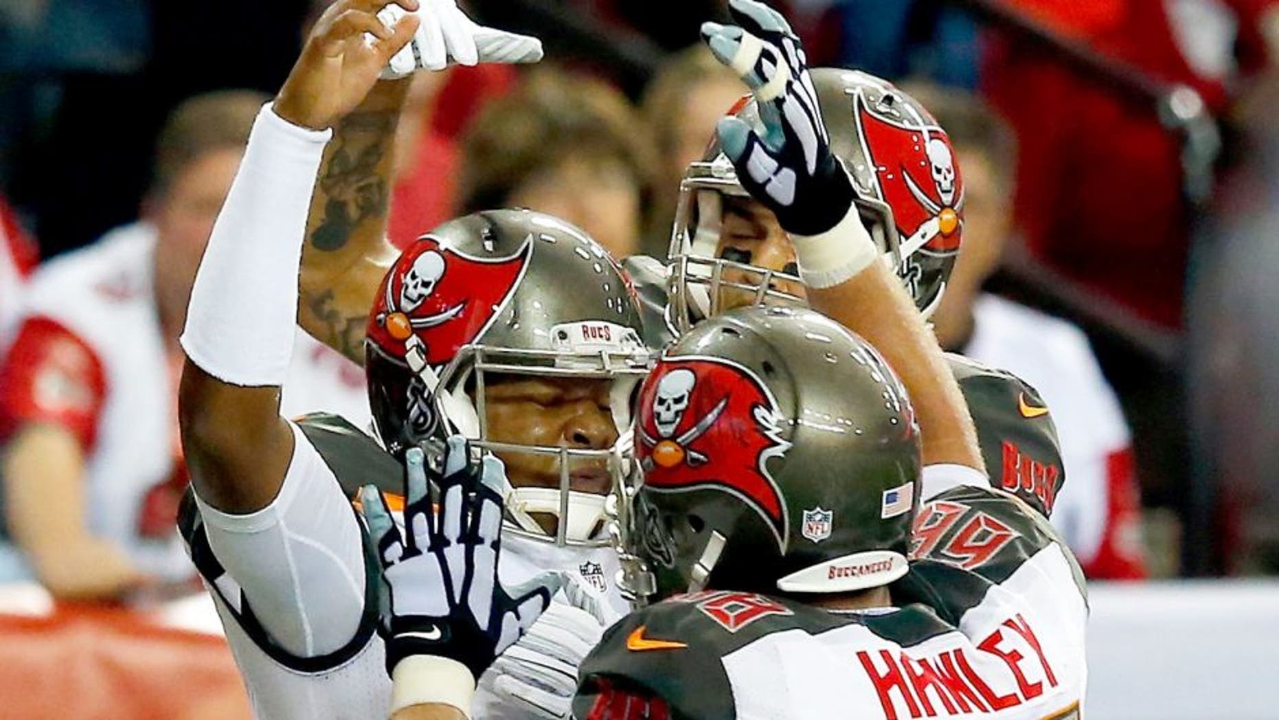 ATLANTA, GA - NOVEMBER 01: Jameis Winston #3 of the Tampa Bay Buccaneers celebrates a touchdown with Joe Hawley #68 of the Tampa Bay Buccaneers during the second half against the Atlanta Falcons at the Georgia Dome on November 1, 2015 in Atlanta, Georgia. (Photo by Kevin C. Cox/Getty Images)