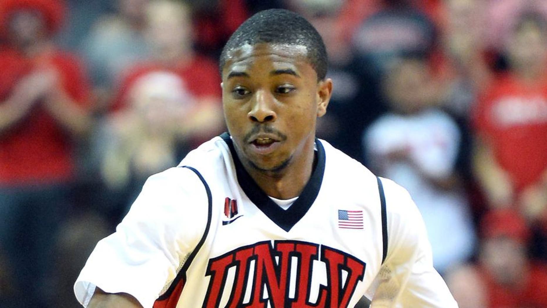 LAS VEGAS, NV - NOVEMBER 26: Daquan Cook #10 of the UNLV Rebels brings the ball up the court against the Illinois Fighting Illini during their game at the Thomas & Mack Center on November 26, 2013 in Las Vegas, Nevada. Illinois won 61-59. (Photo by Ethan Miller/Getty Images)