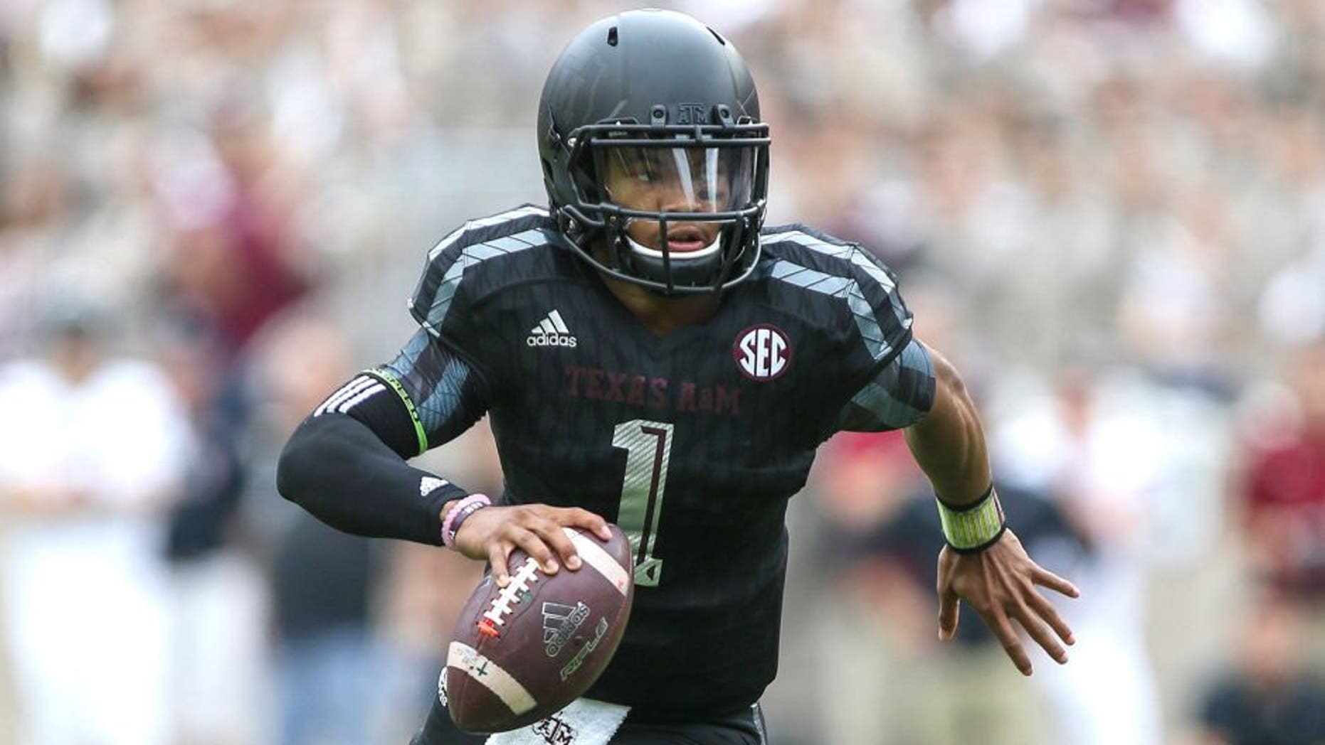Oct 31, 2015; College Station, TX, USA; Texas A&M Aggies quarterback Kyler Murray (1) scrambles with the ball during the first quarter against the South Carolina Gamecocks at Kyle Field. Mandatory Credit: Troy Taormina-USA TODAY Sports