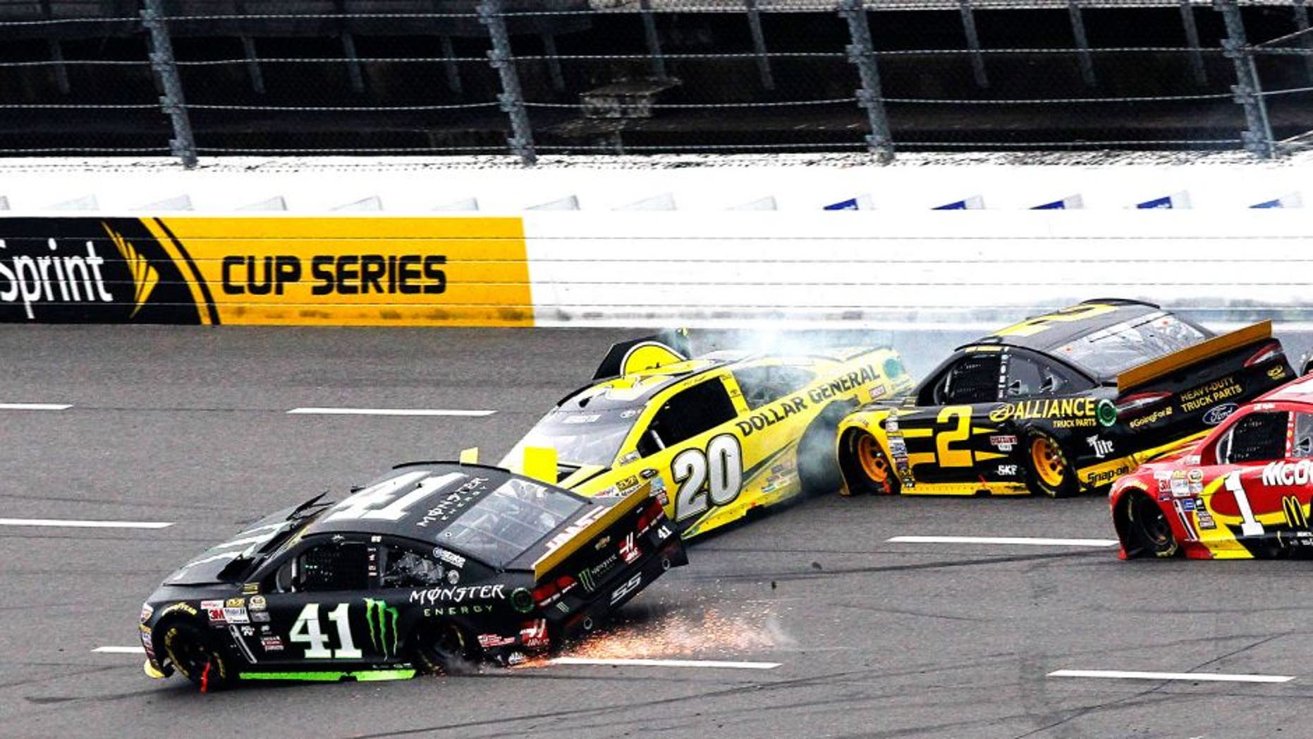 MARTINSVILLE, VA - NOVEMBER 01: Kurt Busch, driver of the #41 Monster Energy Chevrolet, Matt Kenseth, driver of the #20 Dollar General Toyota, Brad Keselowski, driver of the #2 Alliance Truck Parts Ford, and Jamie McMurray, driver of the #1 McDonald's Chevrolet, are involved in an on-track incident during the NASCAR Sprint Cup Series Goody's Headache Relief Shot 500 at Martinsville Speedway on November 1, 2015 in Martinsville, Virginia. (Photo by Brian Lawdermilk/NASCAR via Getty Images)