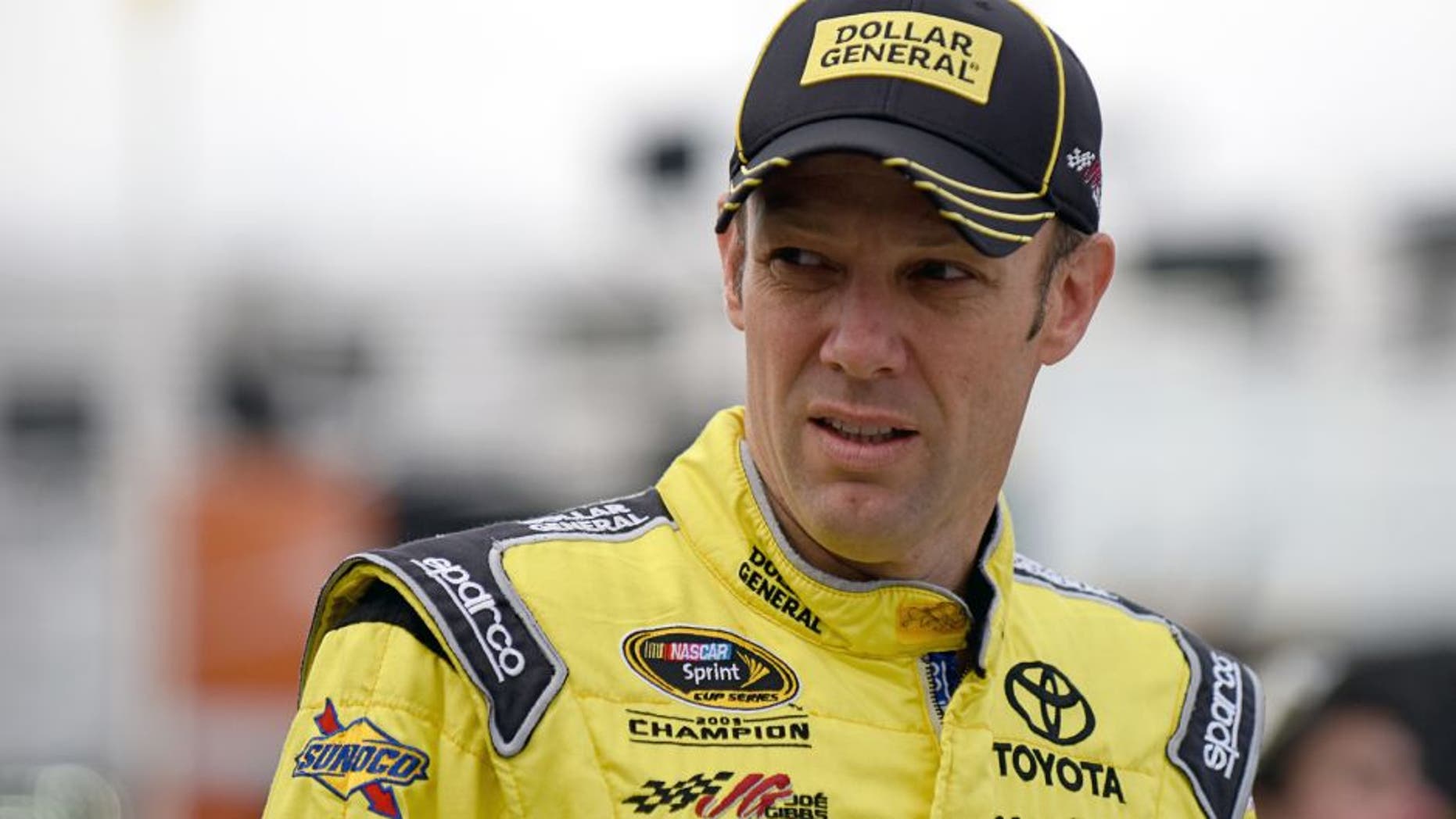 MARTINSVILLE, VA - OCTOBER 31: Matt Kenseth, driver of the #20 Dollar General Toyota, walks through the garage area during practice for the NASCAR Sprint Cup Series Goody's Headache Relief Shot 500 at Martinsville Speedway on October 31, 2015 in Martinsville, Virginia. (Photo by Jonathan Moore/Getty Images)
