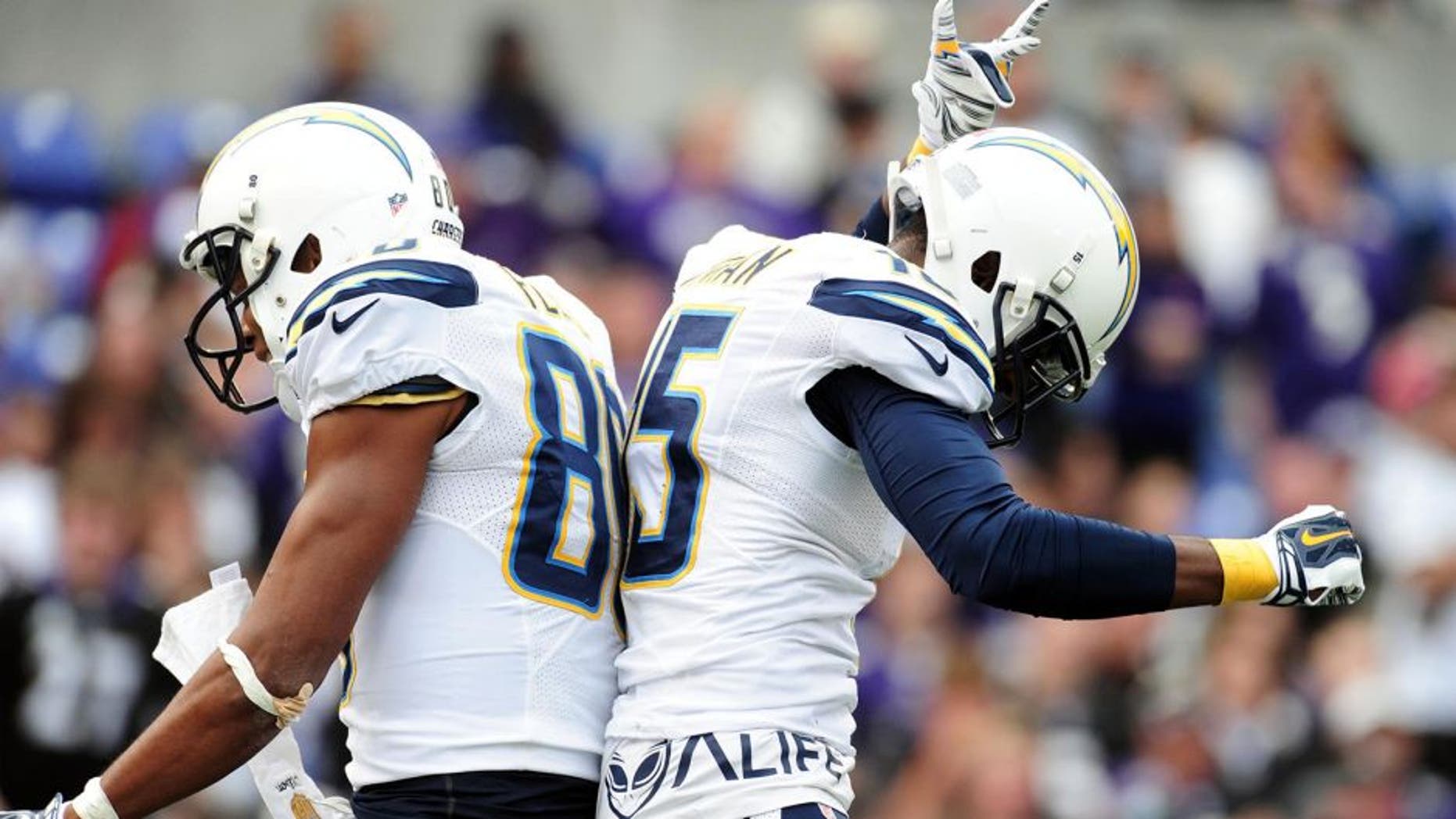 Nov 1, 2015; Baltimore, MD, USA; San Diego Chargers wide receiver Malcolm Floyd (80) is congratulated by wide receiver Dontrelle Inman (15) after scoring a touchdown in the third quarter against the Baltimore Ravens at M&T Bank Stadium. Mandatory Credit: Evan Habeeb-USA TODAY Sports