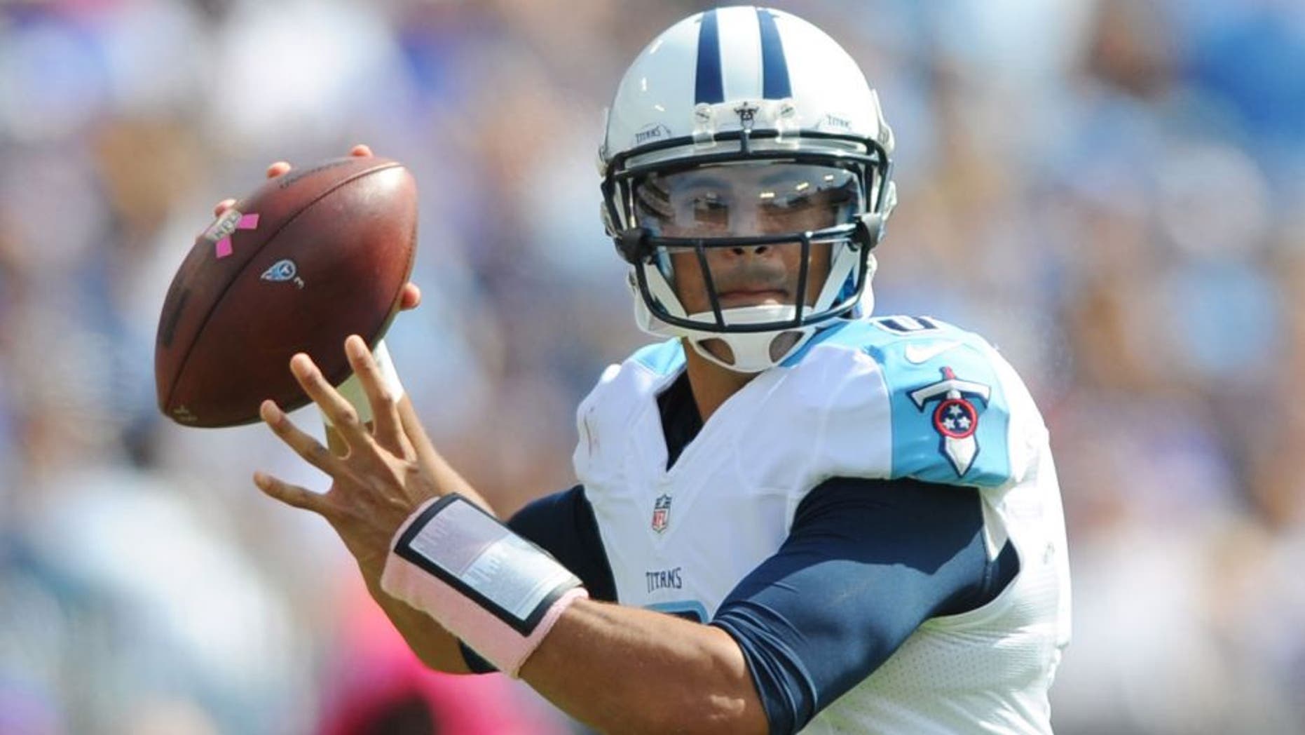Oct 11, 2015; Nashville, TN, USA; Tennessee Titans quarterback Marcus Mariota (8) drops back to pass during the first half against the Buffalo Bills at Nissan Stadium. Mandatory Credit: Christopher Hanewinckel-USA TODAY Sports