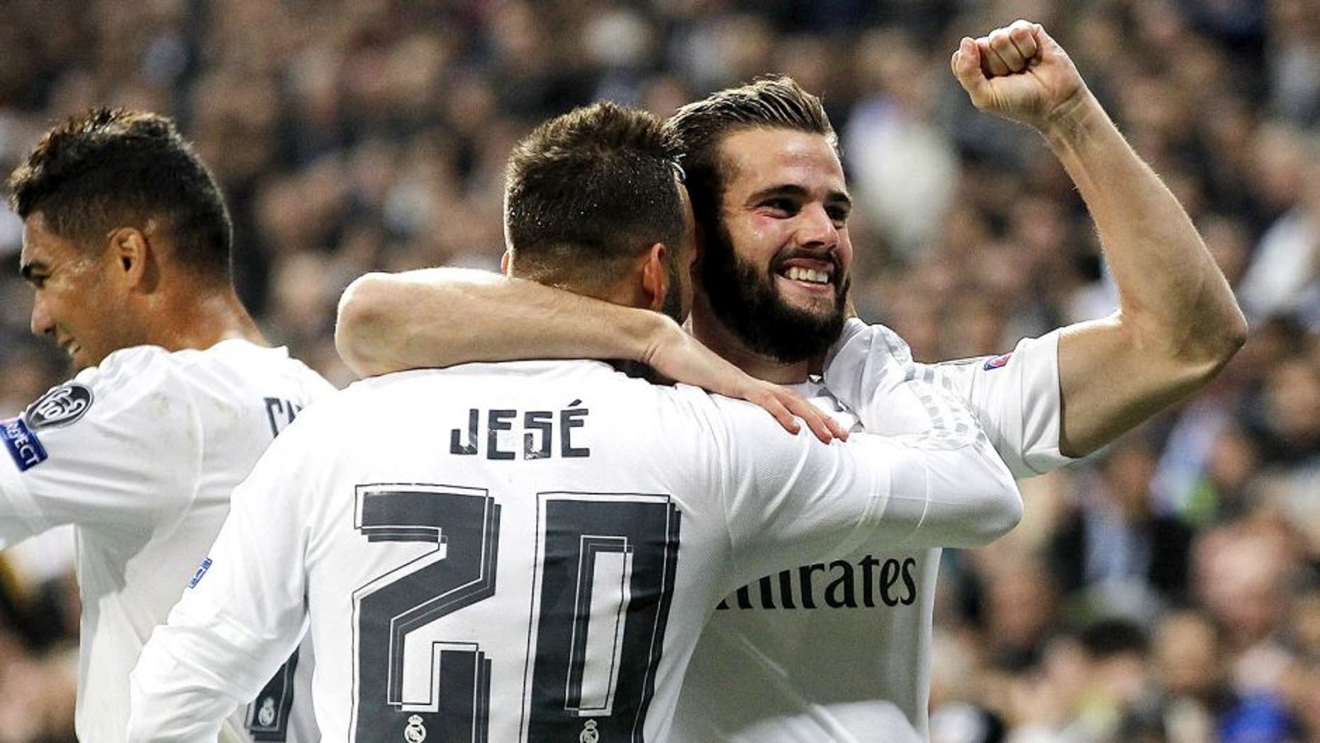 MADRID, SPAIN - NOVEMBER 03: Nacho Fernandez (R) of Real Madrid celebrates with Jese Rodriguez after scoring the opening goal during the UEFA Champions League Group A match between Real Madrid and Paris Saint-Germain at Estadio Santiago Bernabeu on November 3, 2015 in Madrid, Spain. (Photo by Angel Martinez/Real Madrid via Getty Images)