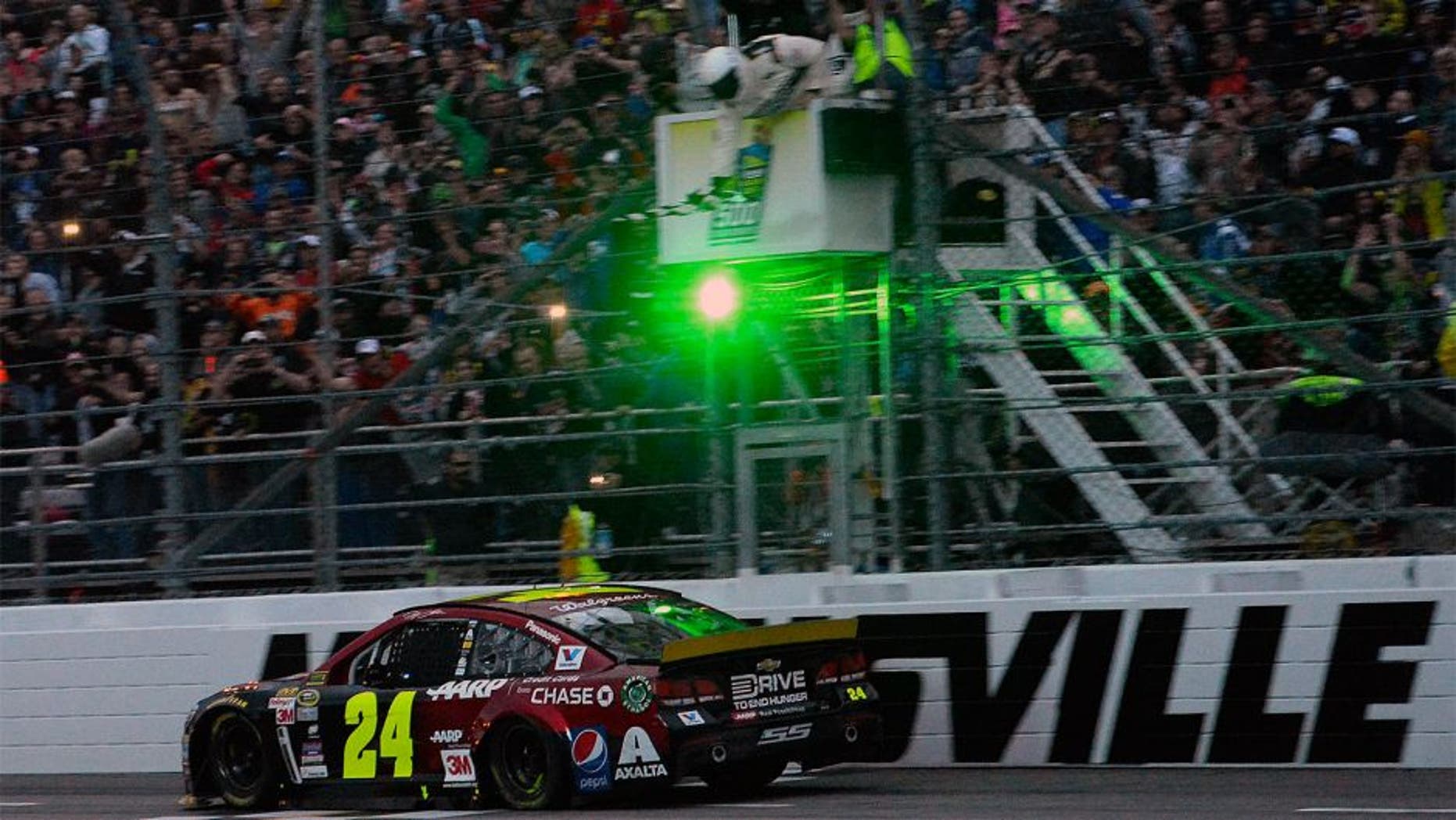 MARTINSVILLE, VA - NOVEMBER 01: Jeff Gordon, driver of the #24 AARP Member Advantages Chevrolet, crosses the finish line to win the NASCAR Sprint Cup Series Goody's Headache Relief Shot 500 at Martinsville Speedway on November 1, 2015 in Martinsville, Virginia. (Photo by Robert Laberge/Getty Images)