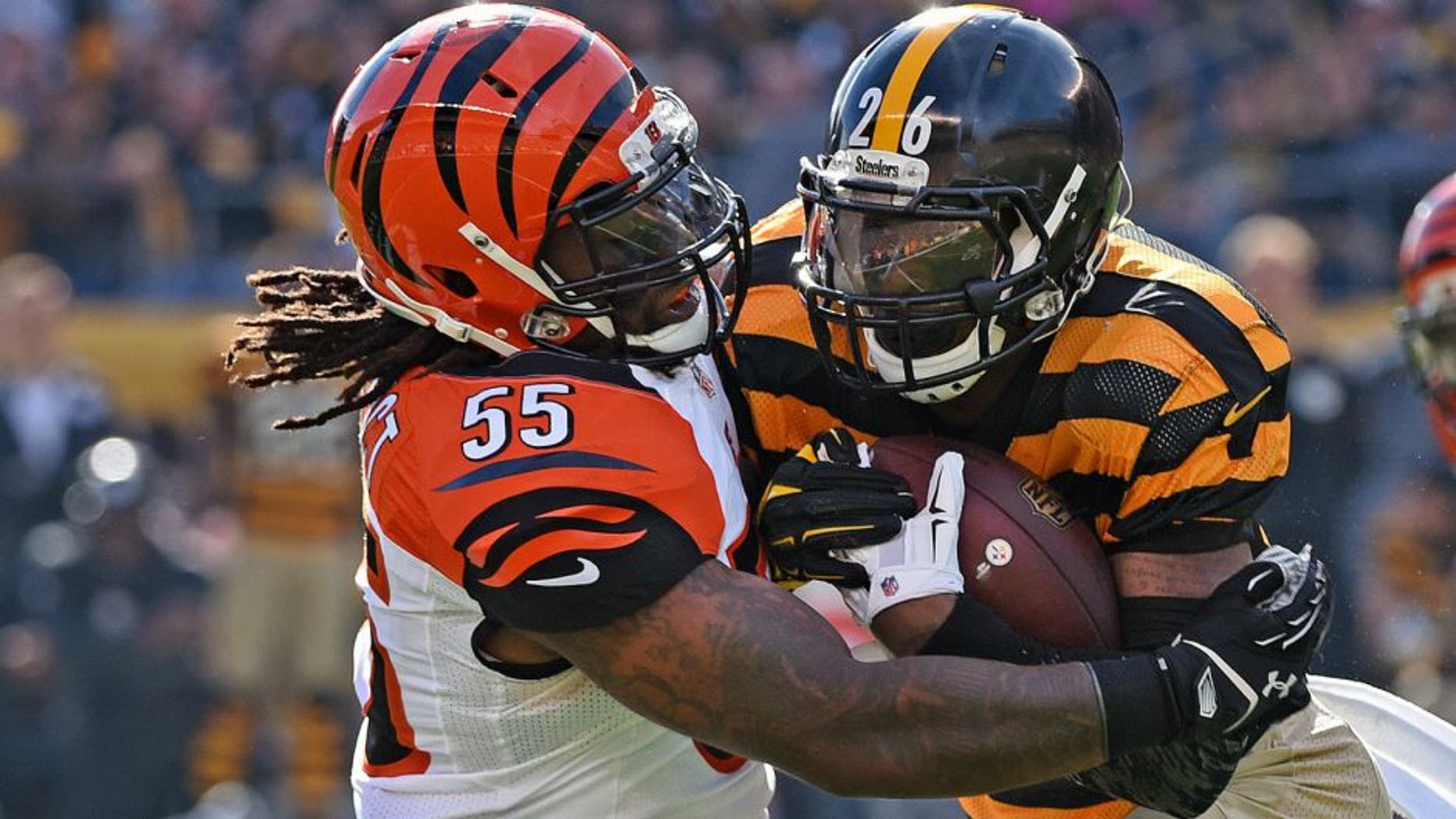 PITTSBURGH, PA - NOVEMBER 1: Linebacker Vontaze Burfict #55 of the Cincinnati Bengals tackles running back Le'Veon Bell #26 of the Pittsburgh Steelers during a game at Heinz Field on November 1, 2015 in Pittsburgh, Pennsylvania. The Bengals defeated the Steelers 16-10. (Photo by George Gojkovich/Getty Images)