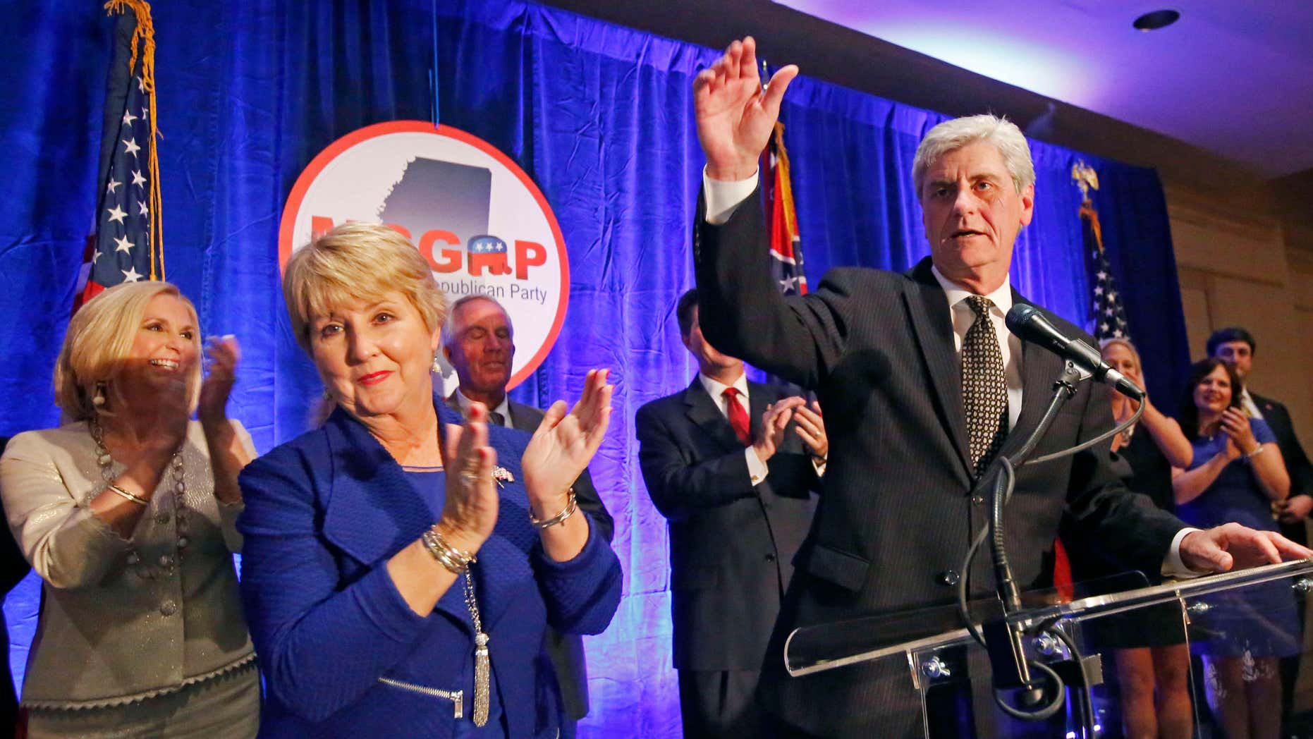 Nov. 3, 2015: Republican Gov. Phil Bryant, right, and wife Deborah acknowledge friends and supporters during an election day party in Jackson, Miss.