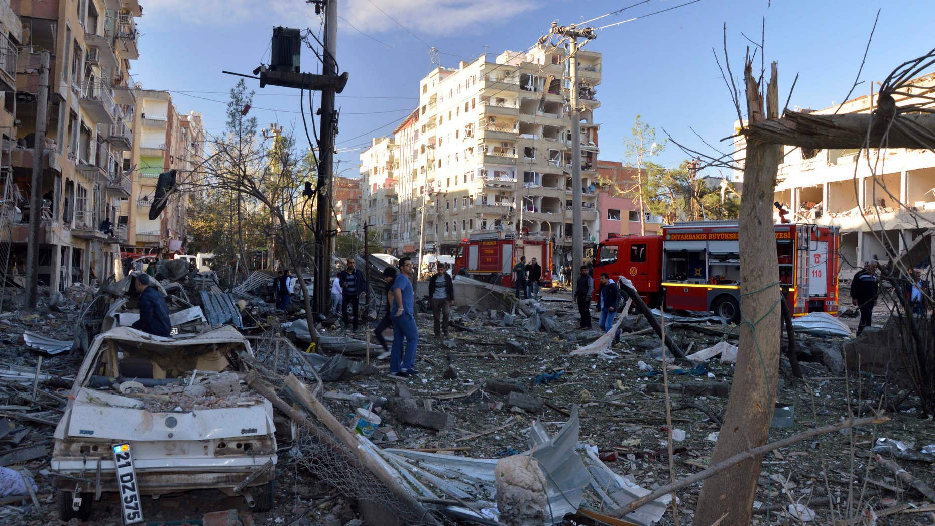 Nov. 4, 2016: People watch the damage after an explosion in southeastern Turkish city of Diyarbakir.